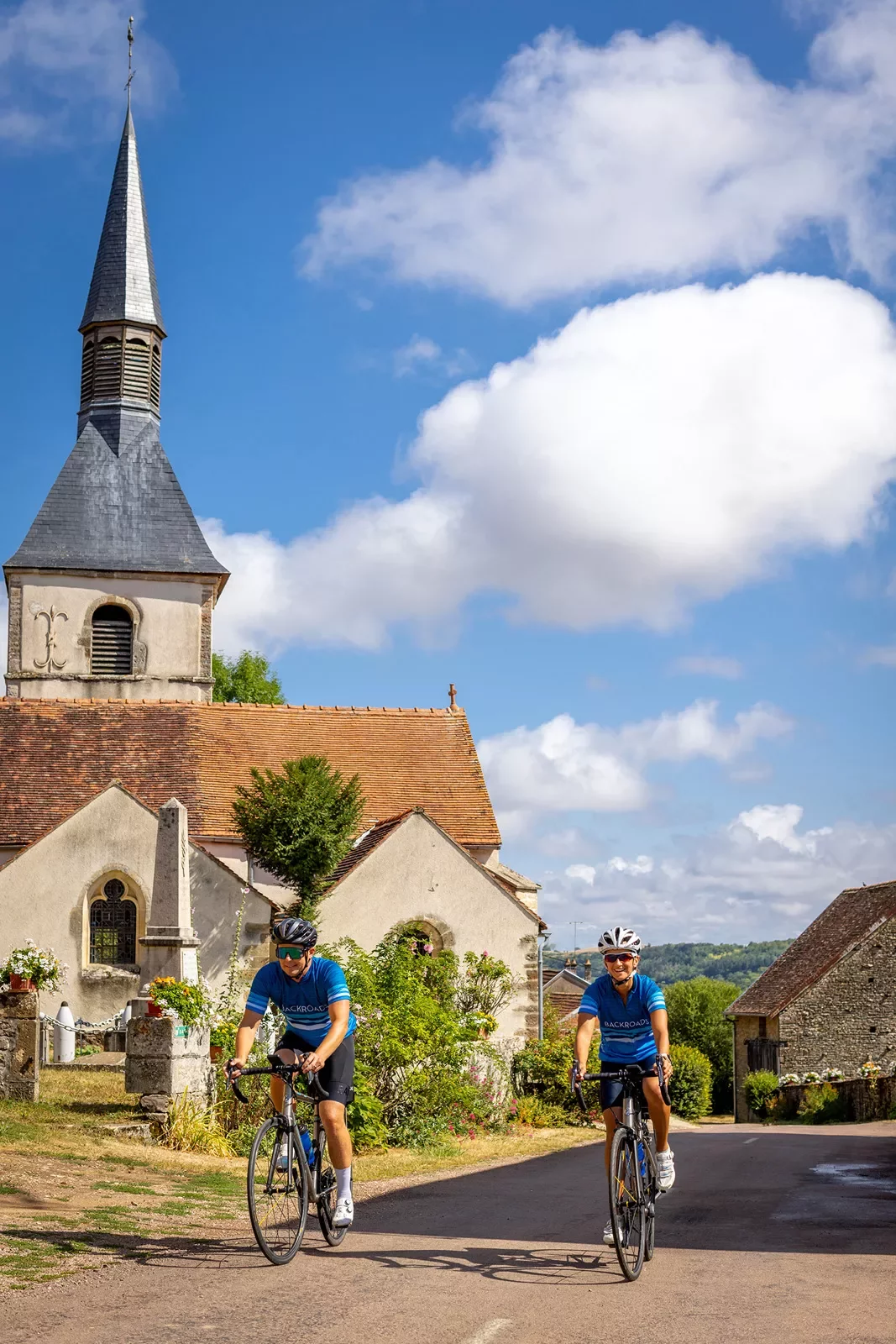 Two Backroads Guests Biking Through Town in Burgundy