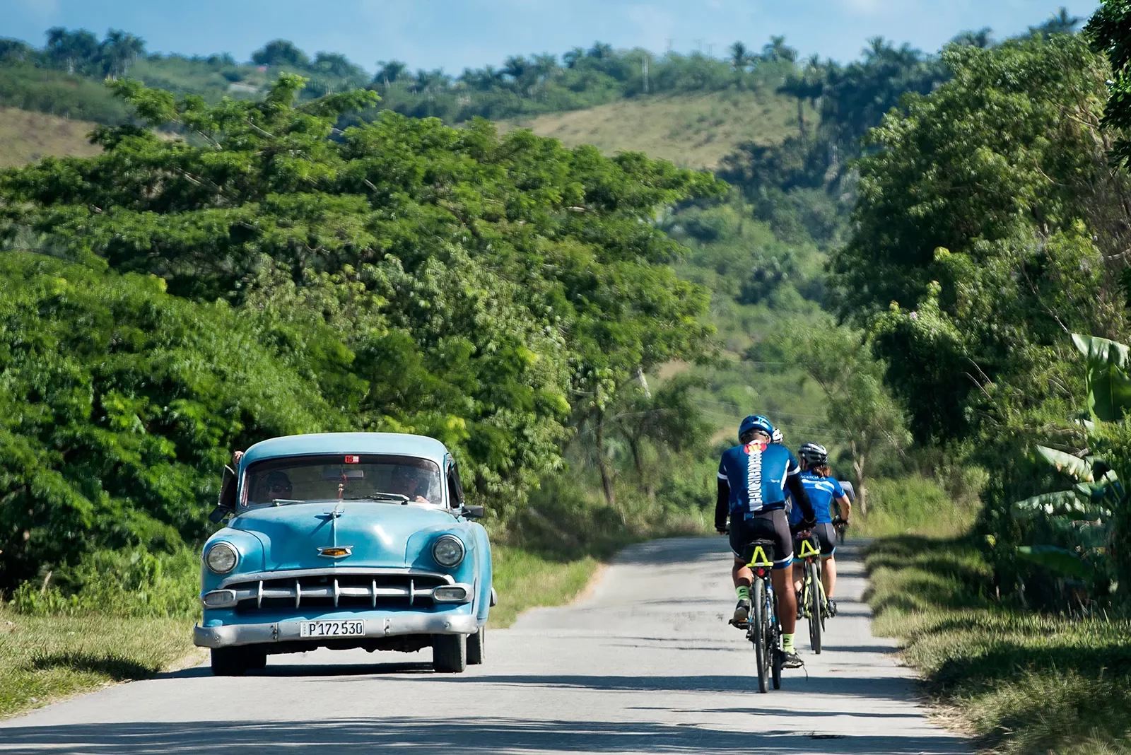 Cycling Past Classic Car