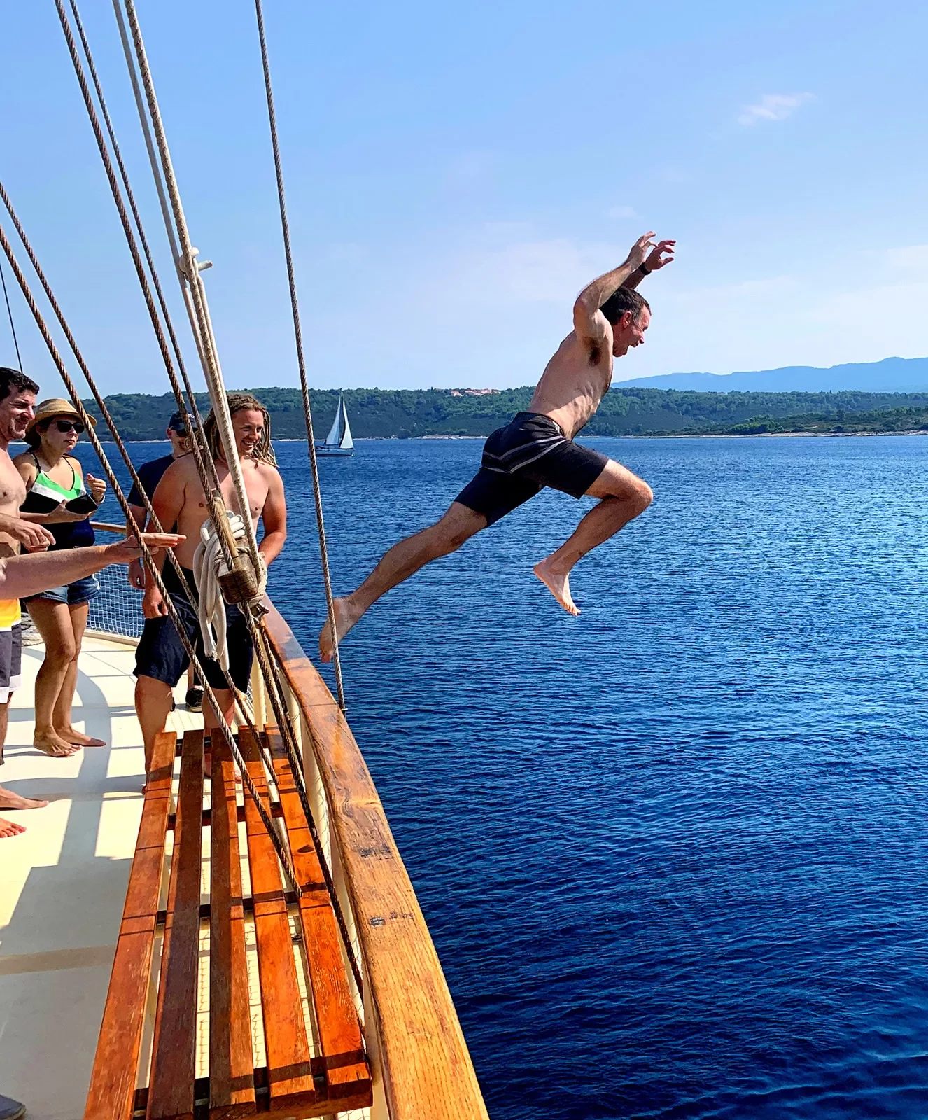 Guests jumping off boat.