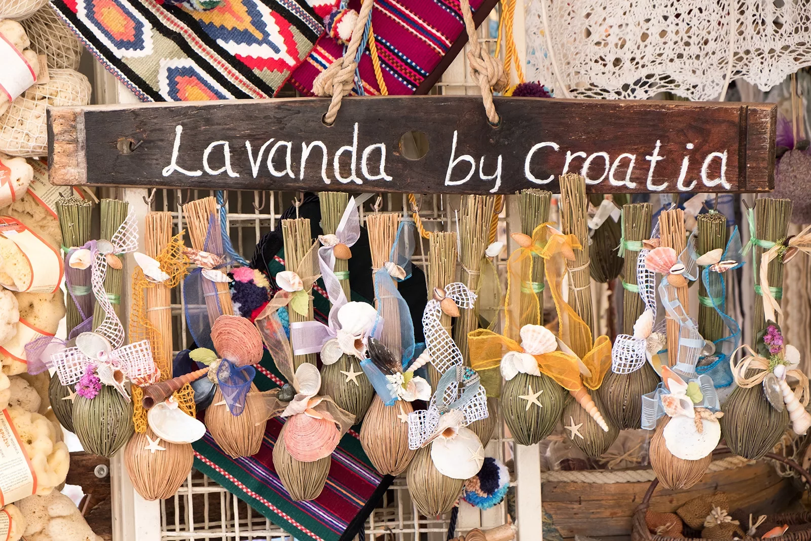 Close-up of Croatian storefront, &quot;Lavanda&quot;. Hanging seashells.