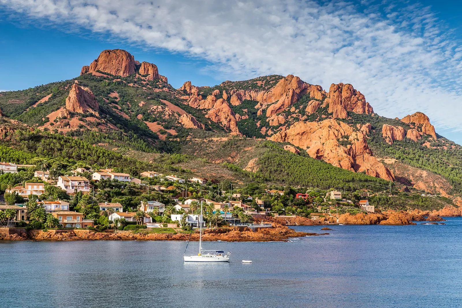 Village And Trees Among Red Rocks of Esterel Massif During Sunny Day-French Riviera, Provence-Alpes, Cote d'Azur, France