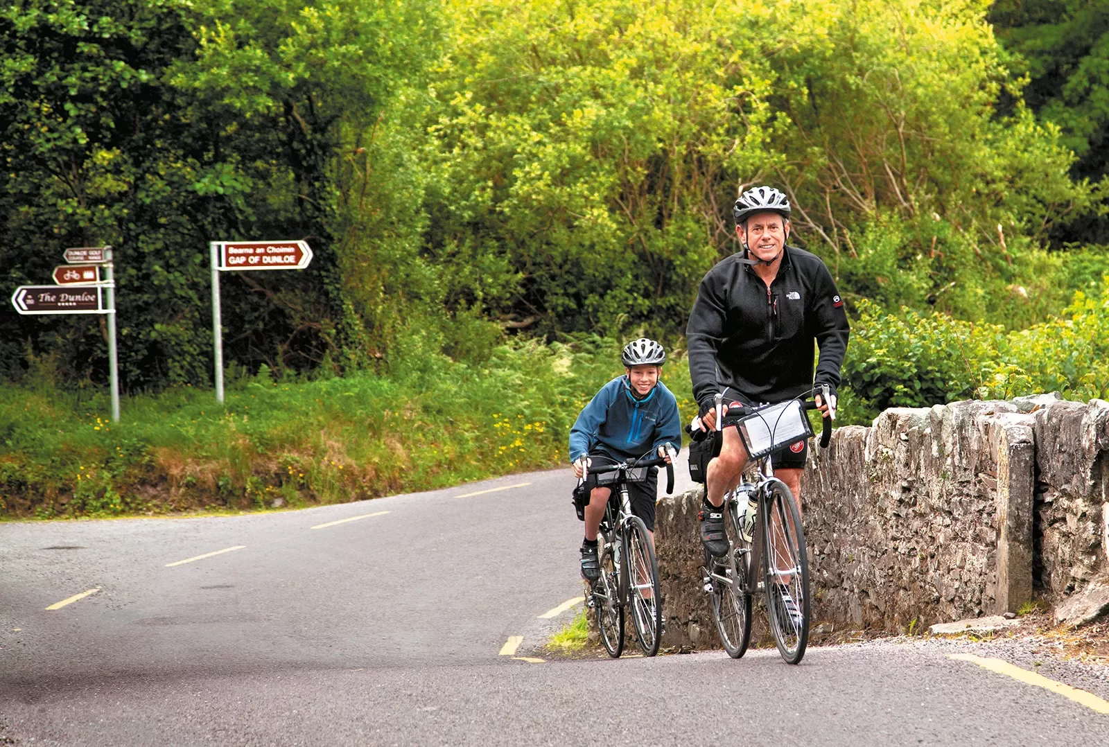 Father Son Riding Up Hill Ireland