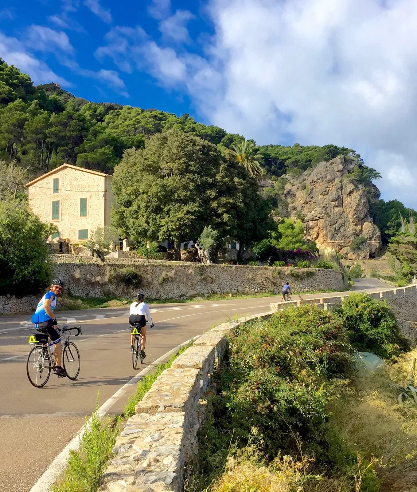 Bikers riding on coastal road in Mallorca.