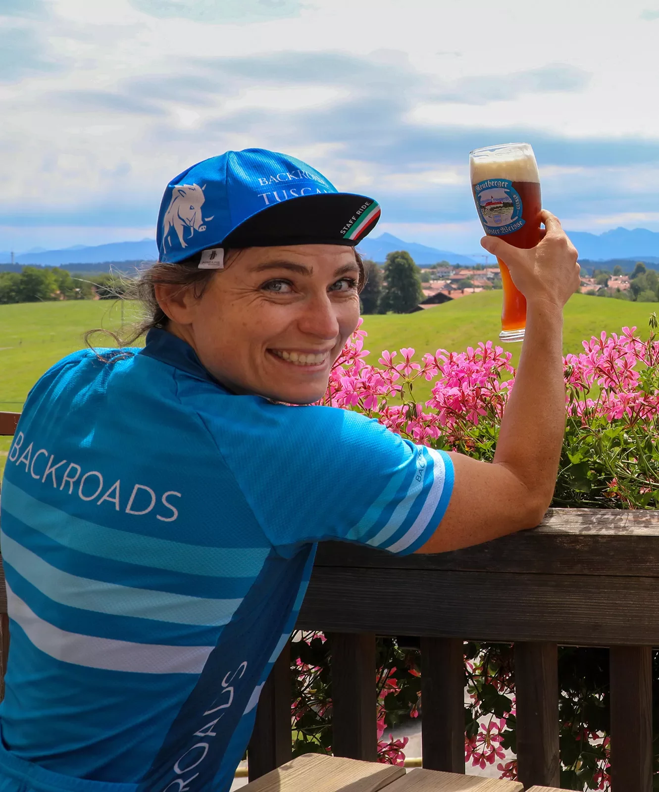 Backroads leader posing with pint of beer.