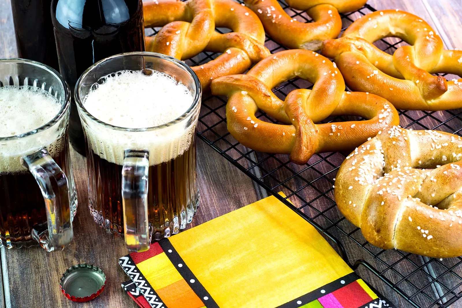 Glasses of beer and soft pretzels.