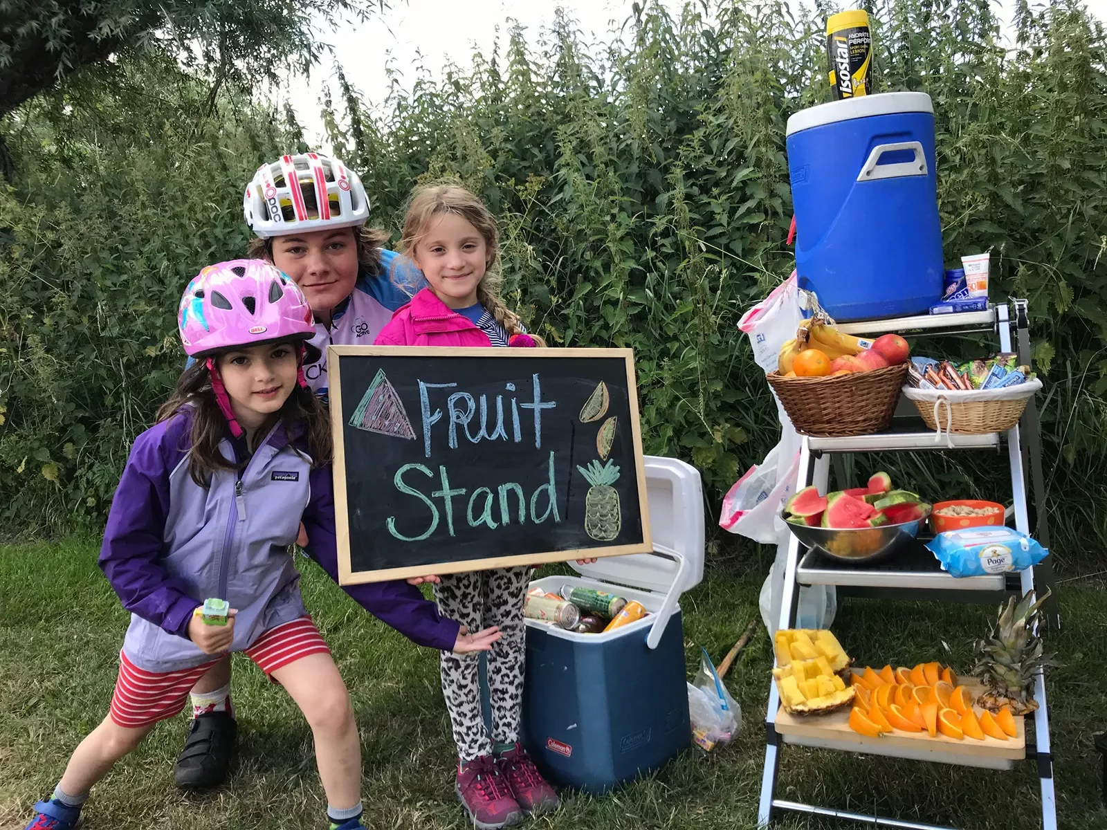 Kids posing at fruit stand snack table