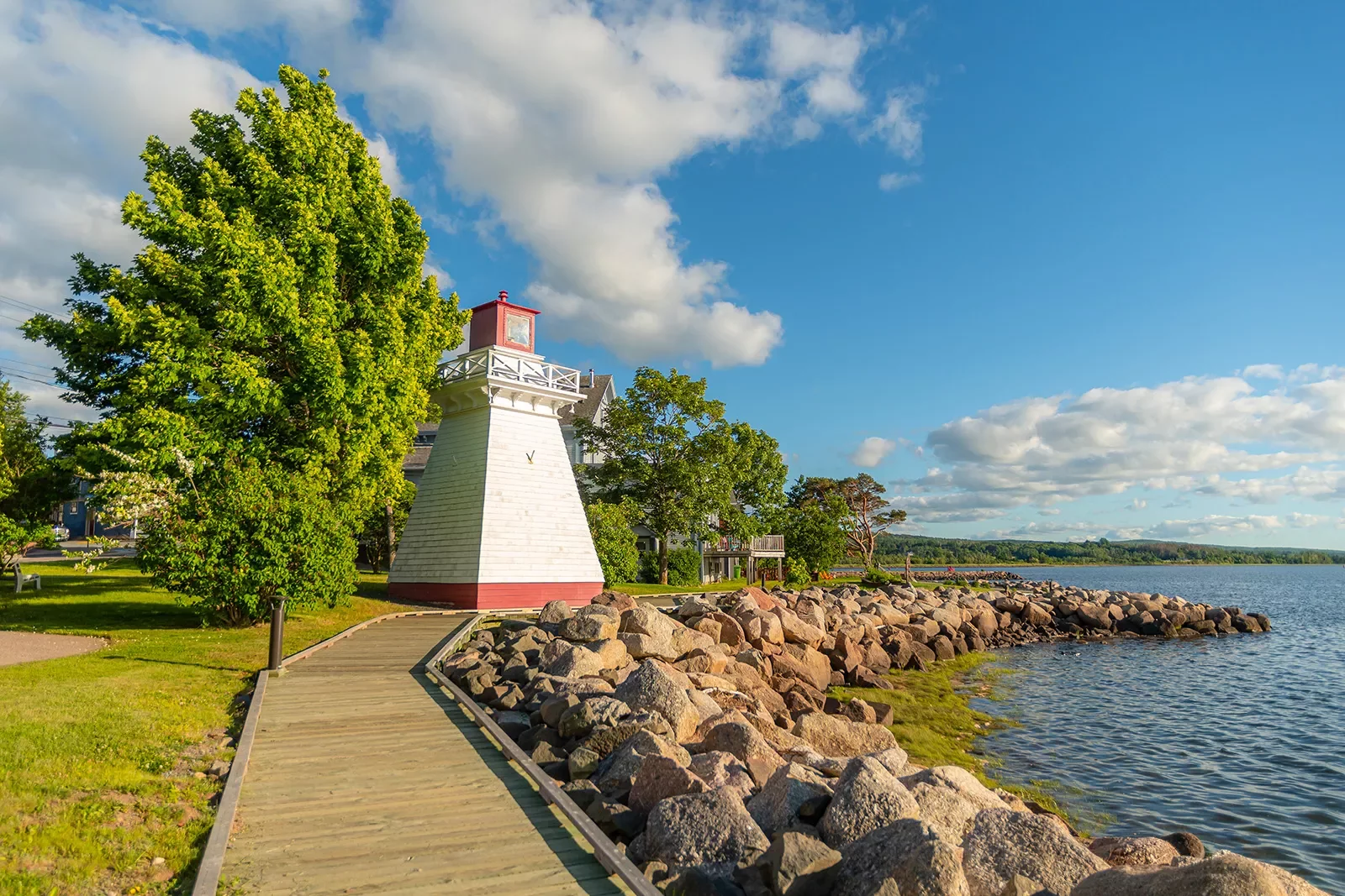 Shot of Canadian coastline, small red lighthouse.