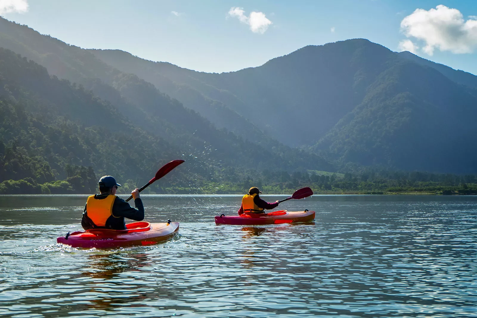 Asia &amp; Pacific Kayaking on River with Mountain View