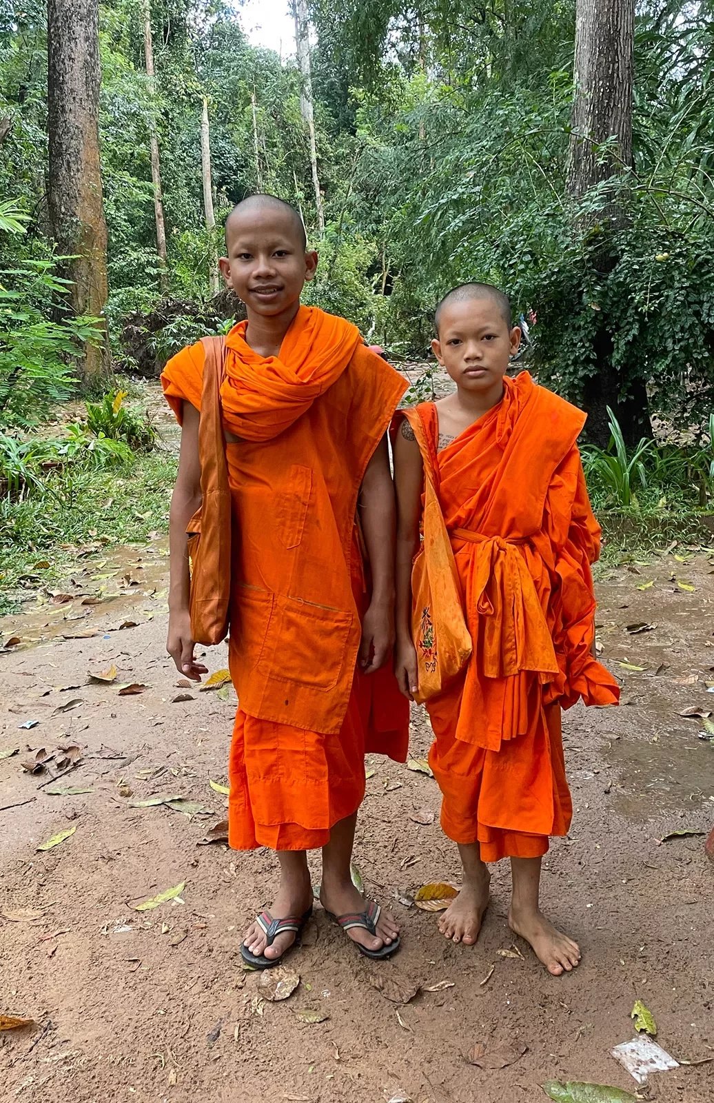 Two monks in traditional orange robes
