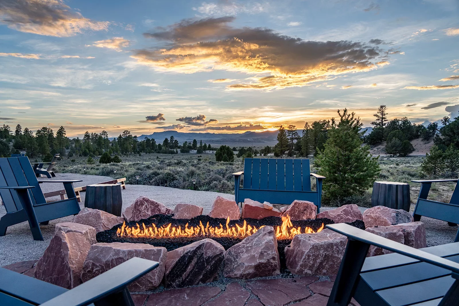 An outdoor fire pit at sunset