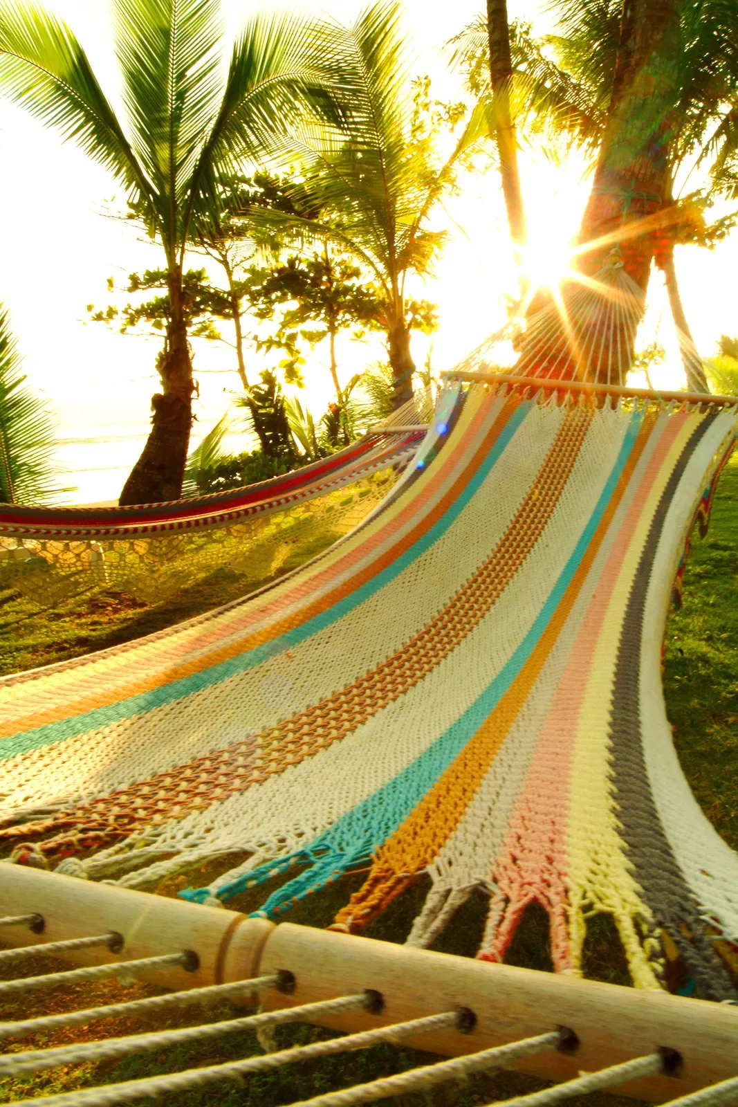 Close-up of multi-colored hammock, sunset.