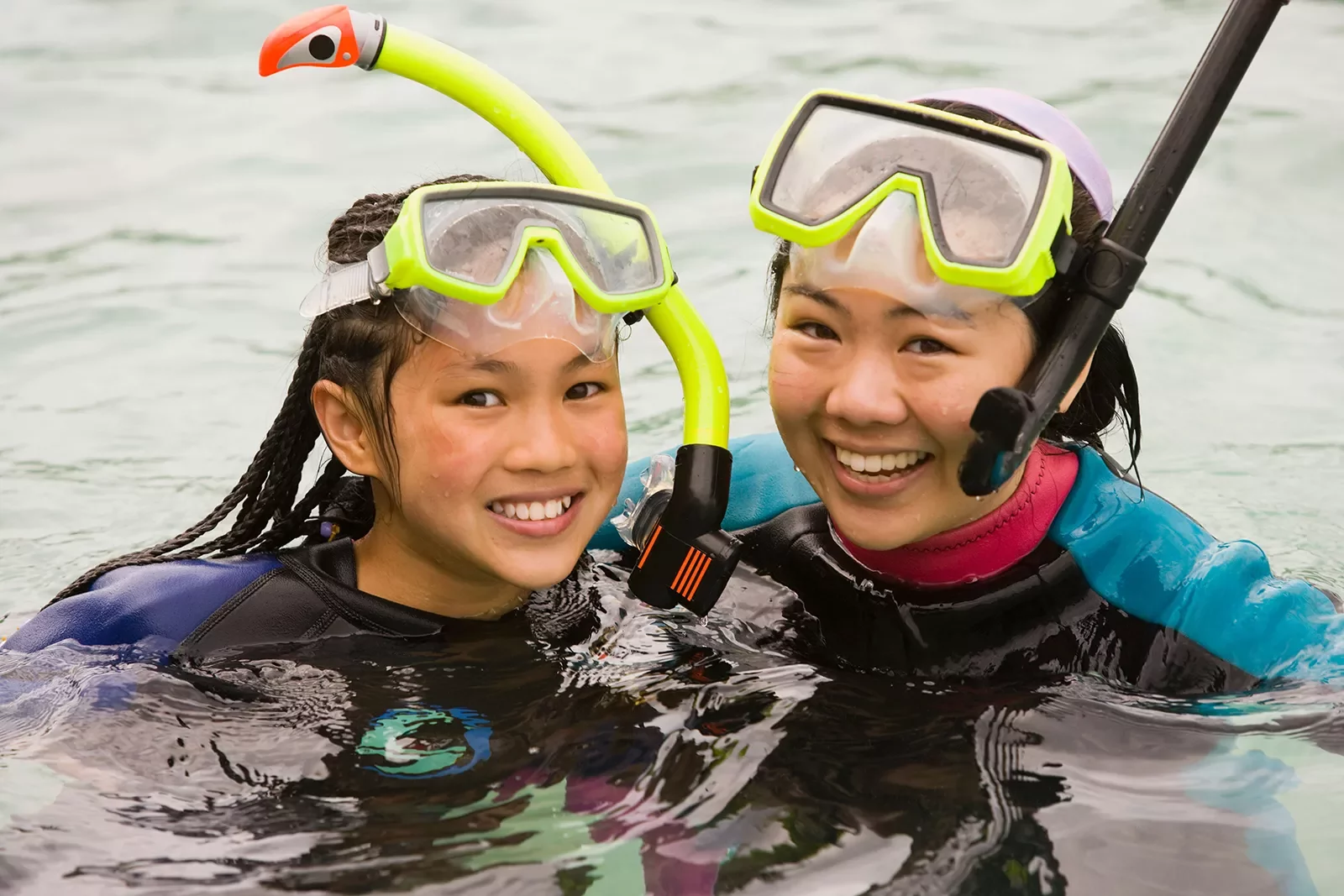 Close-up of two guests in snorkeling gear.