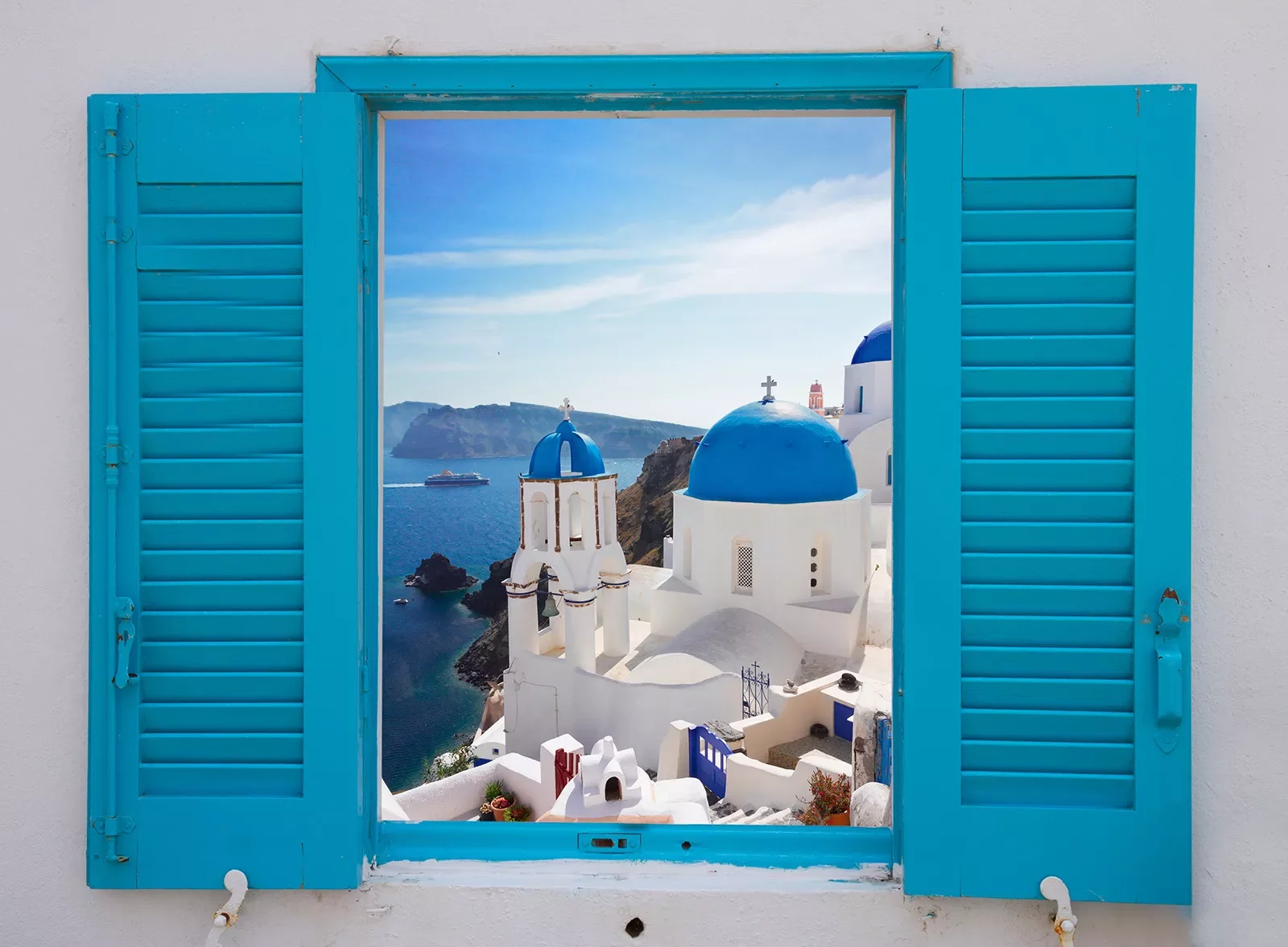 Light blue windowsill, overlooking blue and white Mediterranean domed houses.