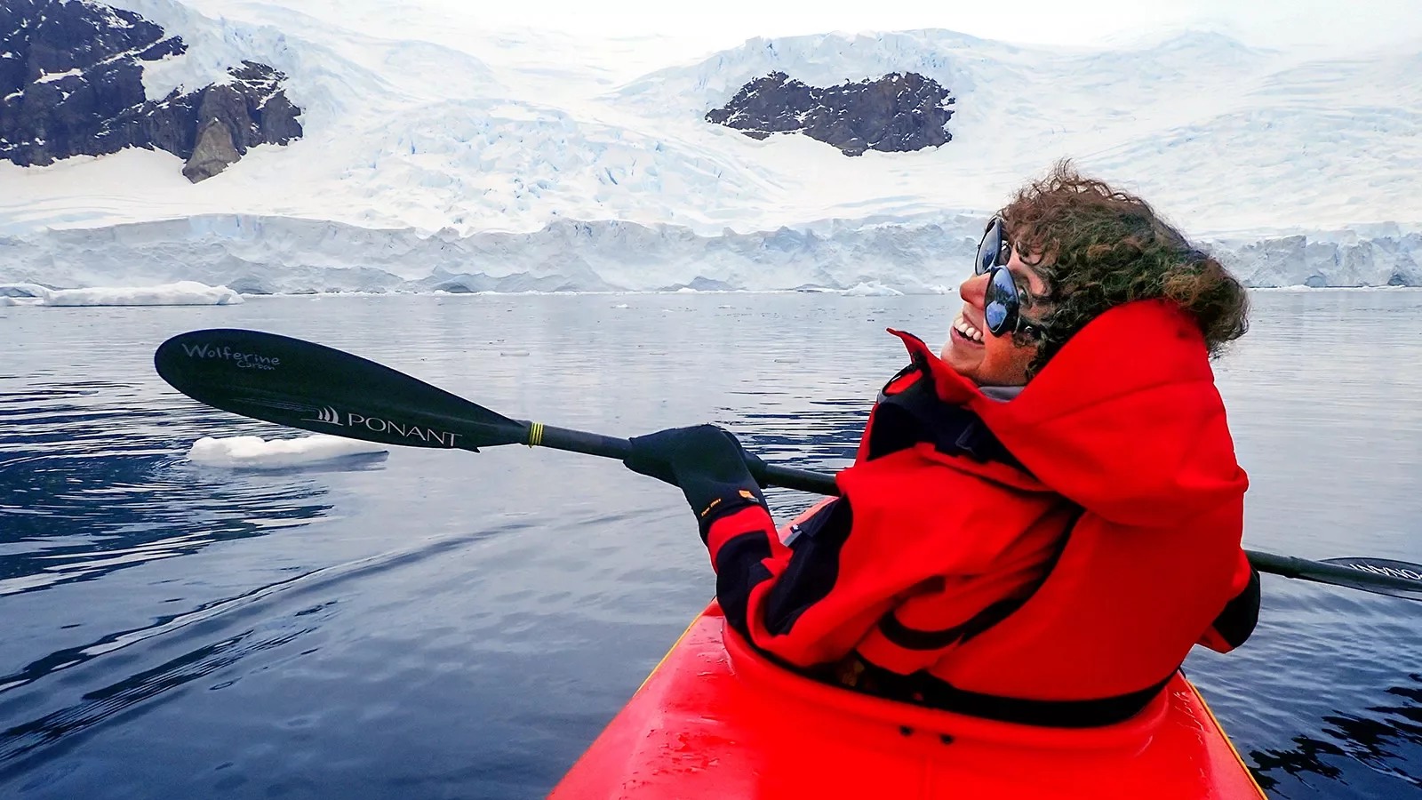 Person kayaking in the icy waters of Antarctica