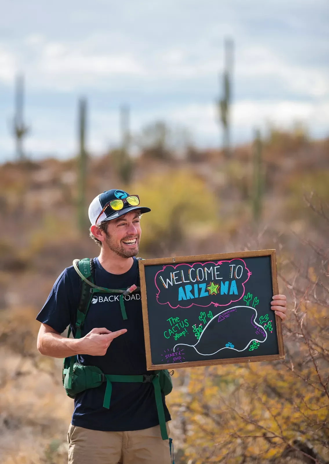 Leader holding a welcome to Arizona sign