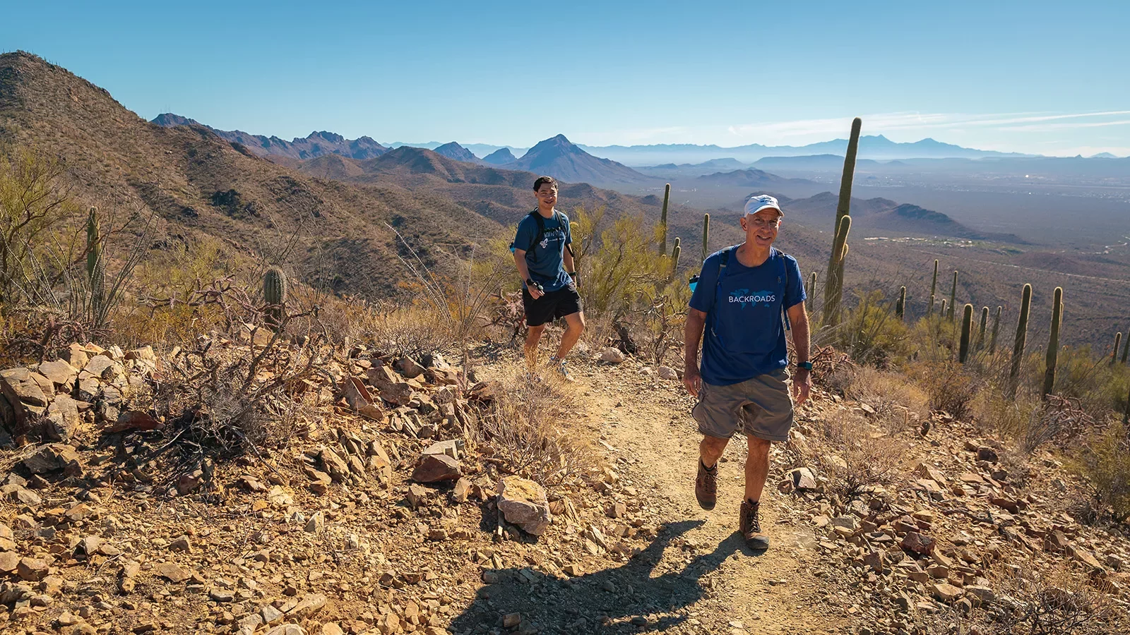 Man and boy hiking in desert AZ