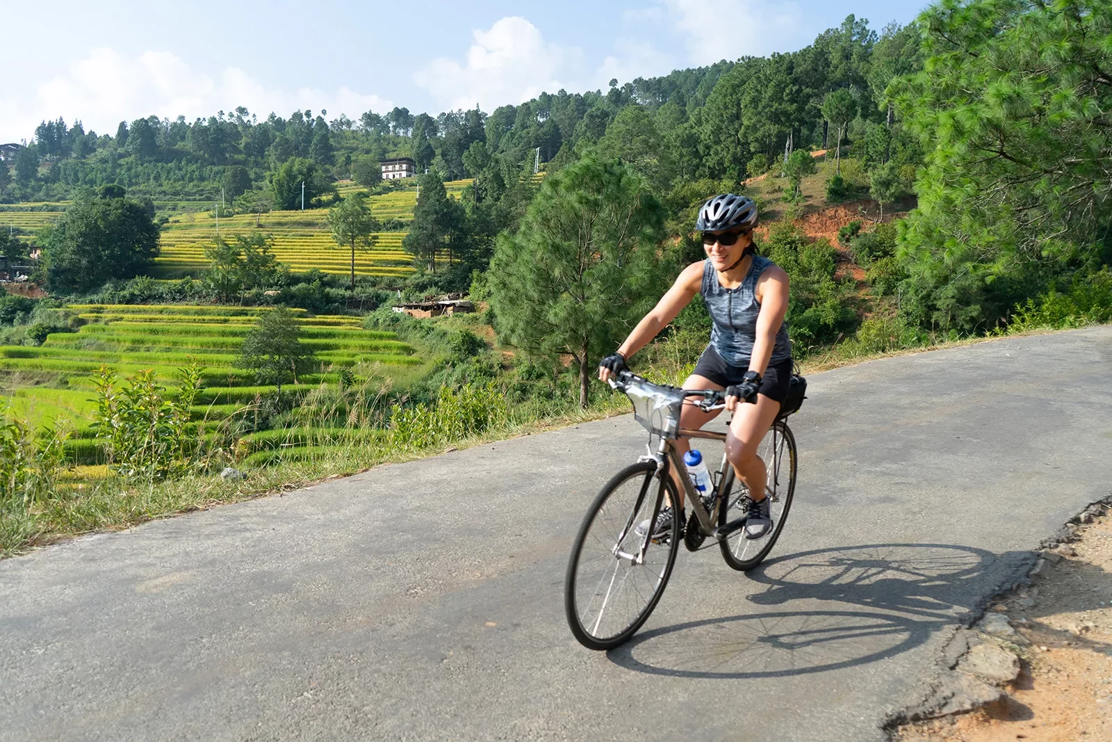 Biker riding along a road in Bhutan