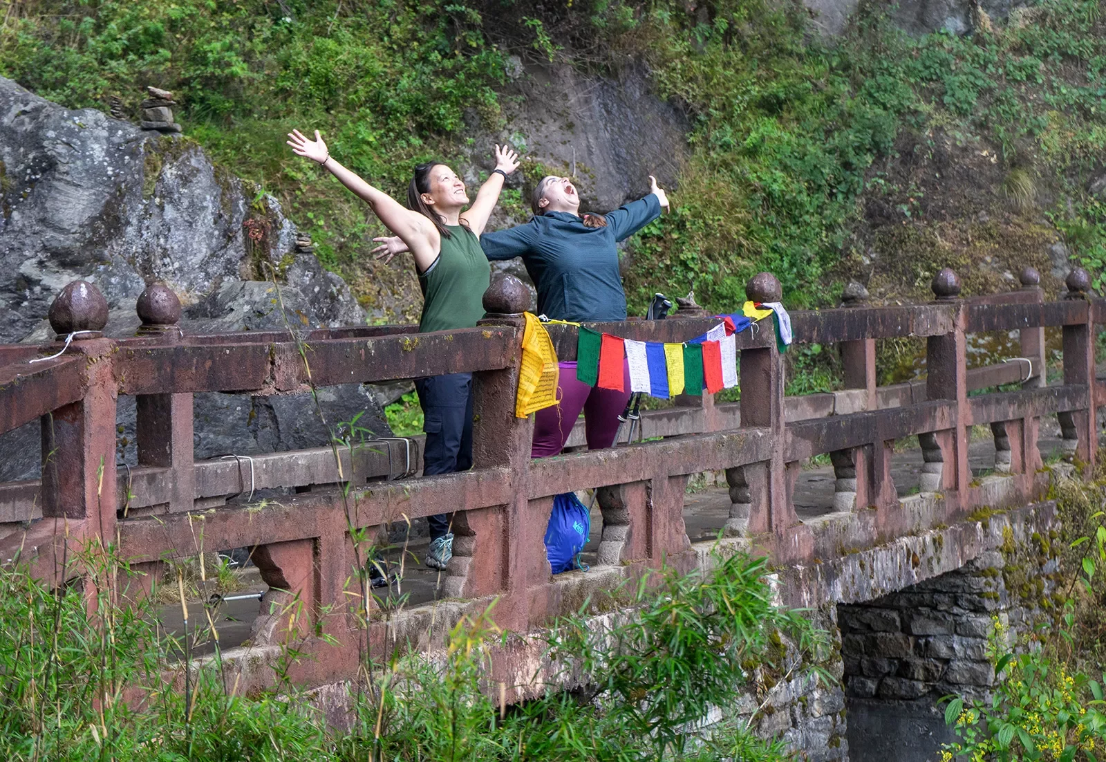 Guests walking across a bridge in Bhutan