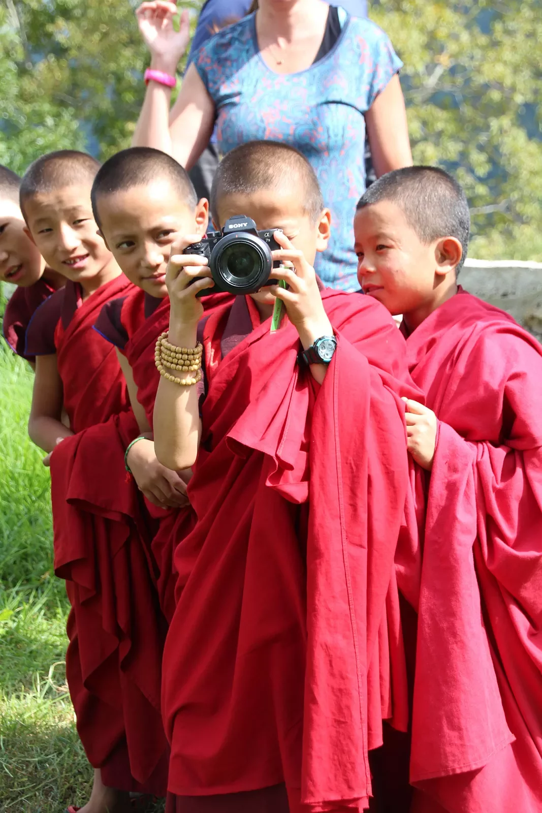 Group of young monks with a camera