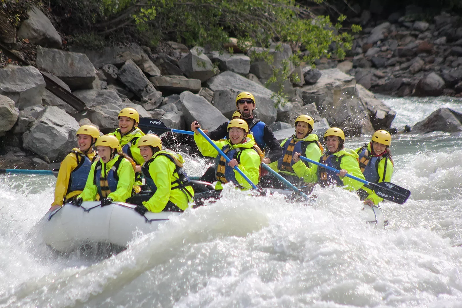 Group of guests white-water rafting.