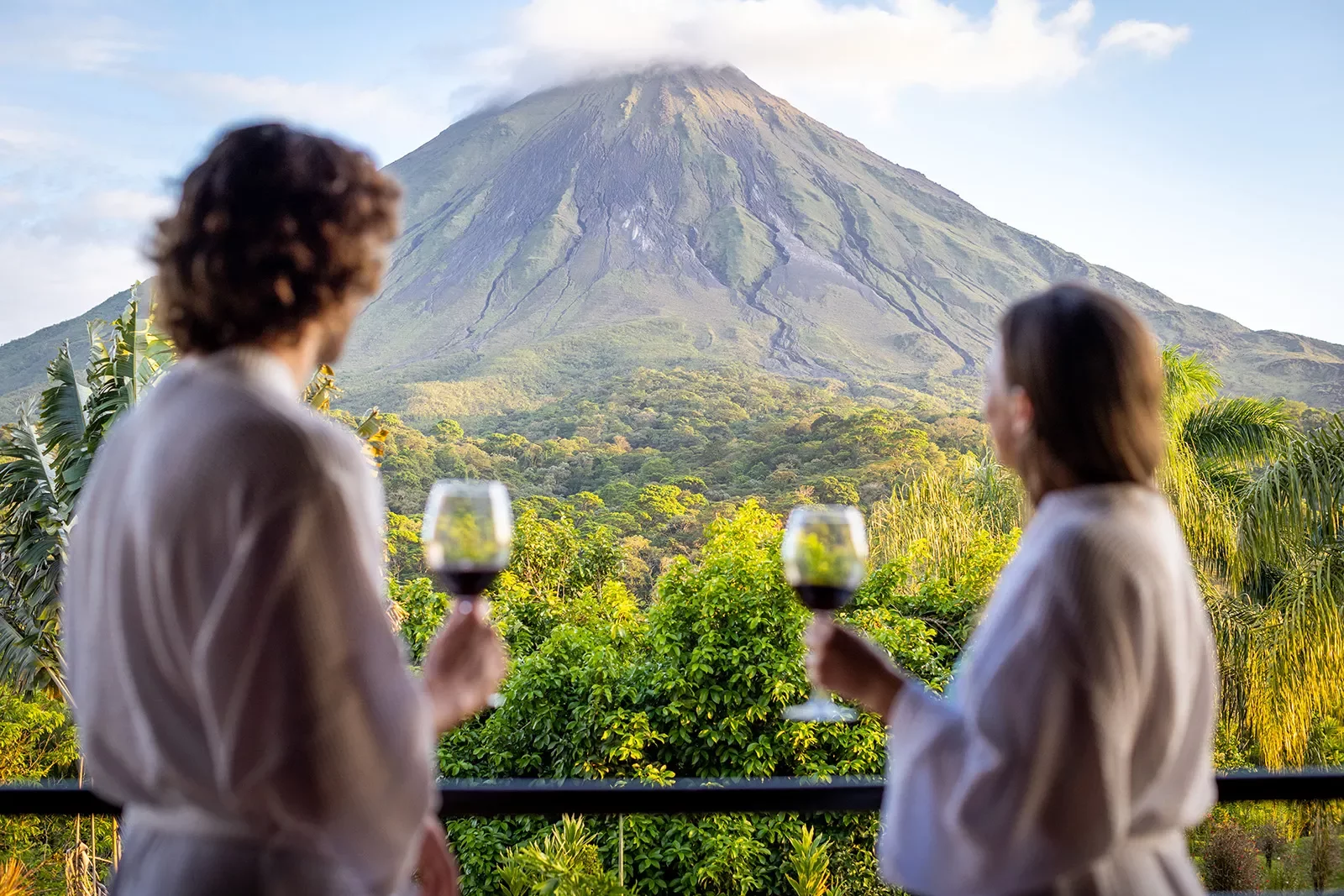 Enjoying Wine Looking up Arenal Volcano Costa Rica