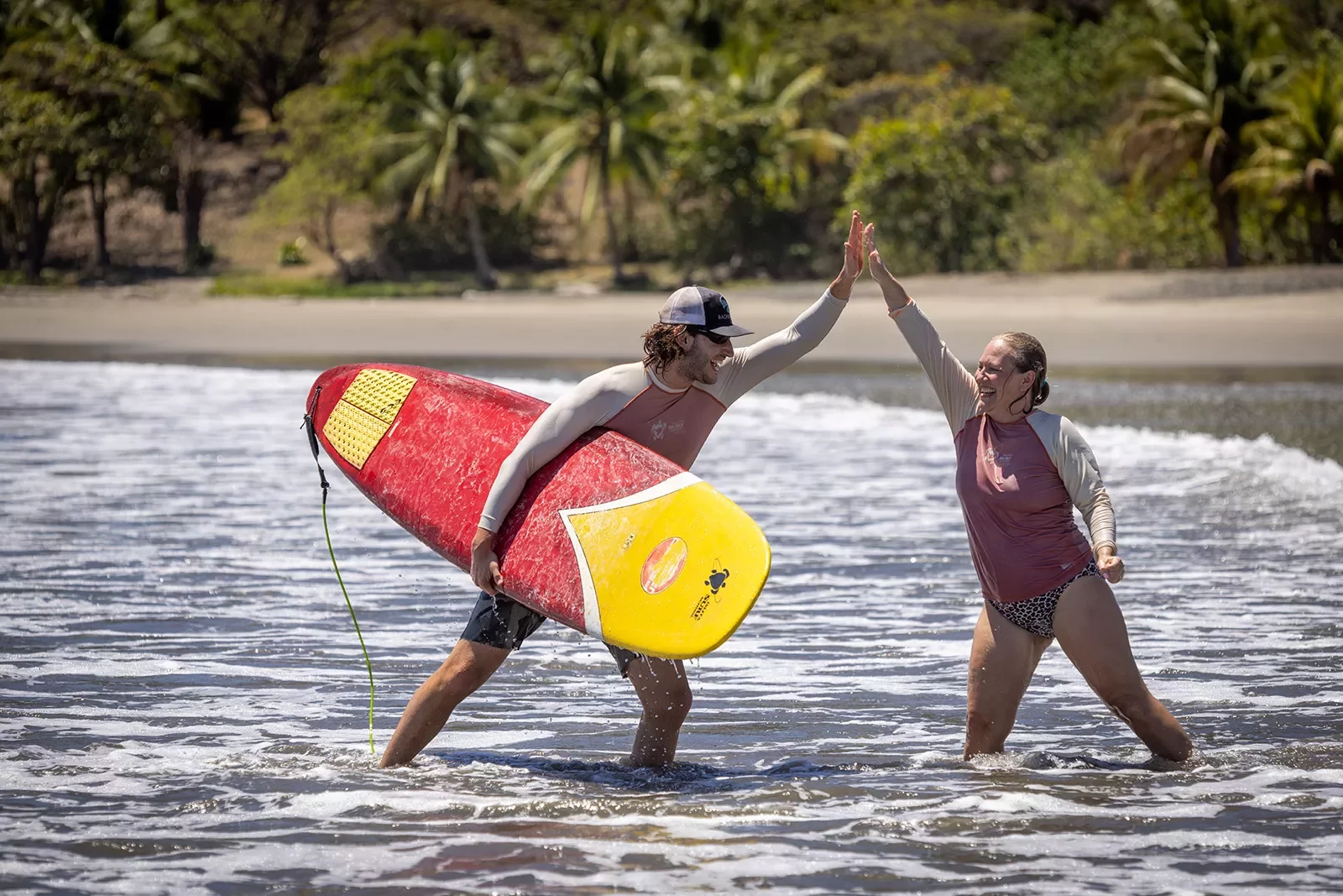 Hi Five After Surfing Instructor Student Costa Rica