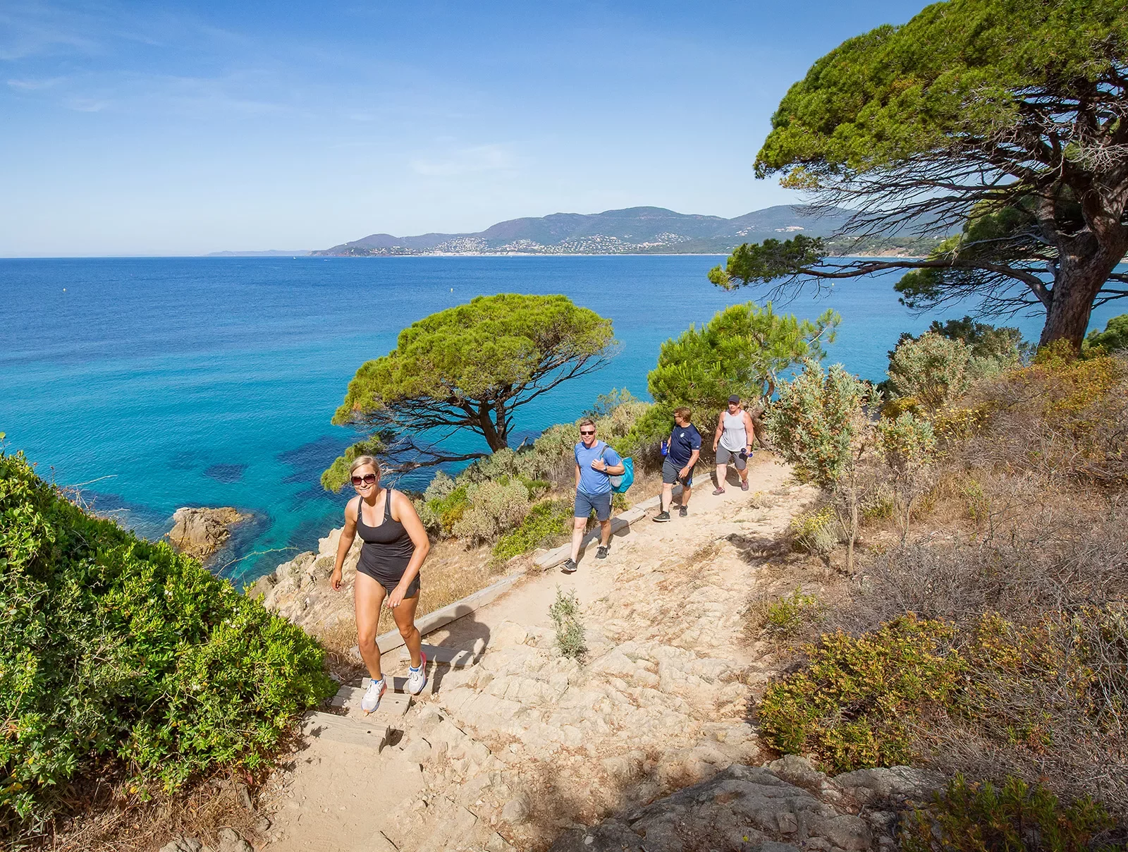 Group of backroads guests hiking along the coast in France