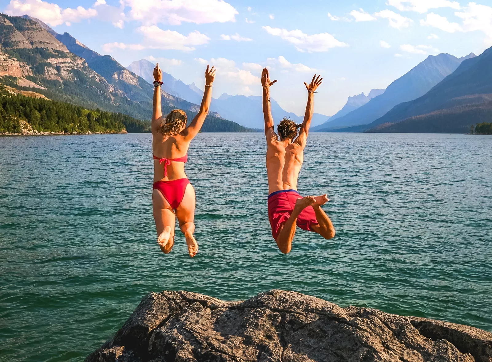 Backroads guests rock jumping into blue water