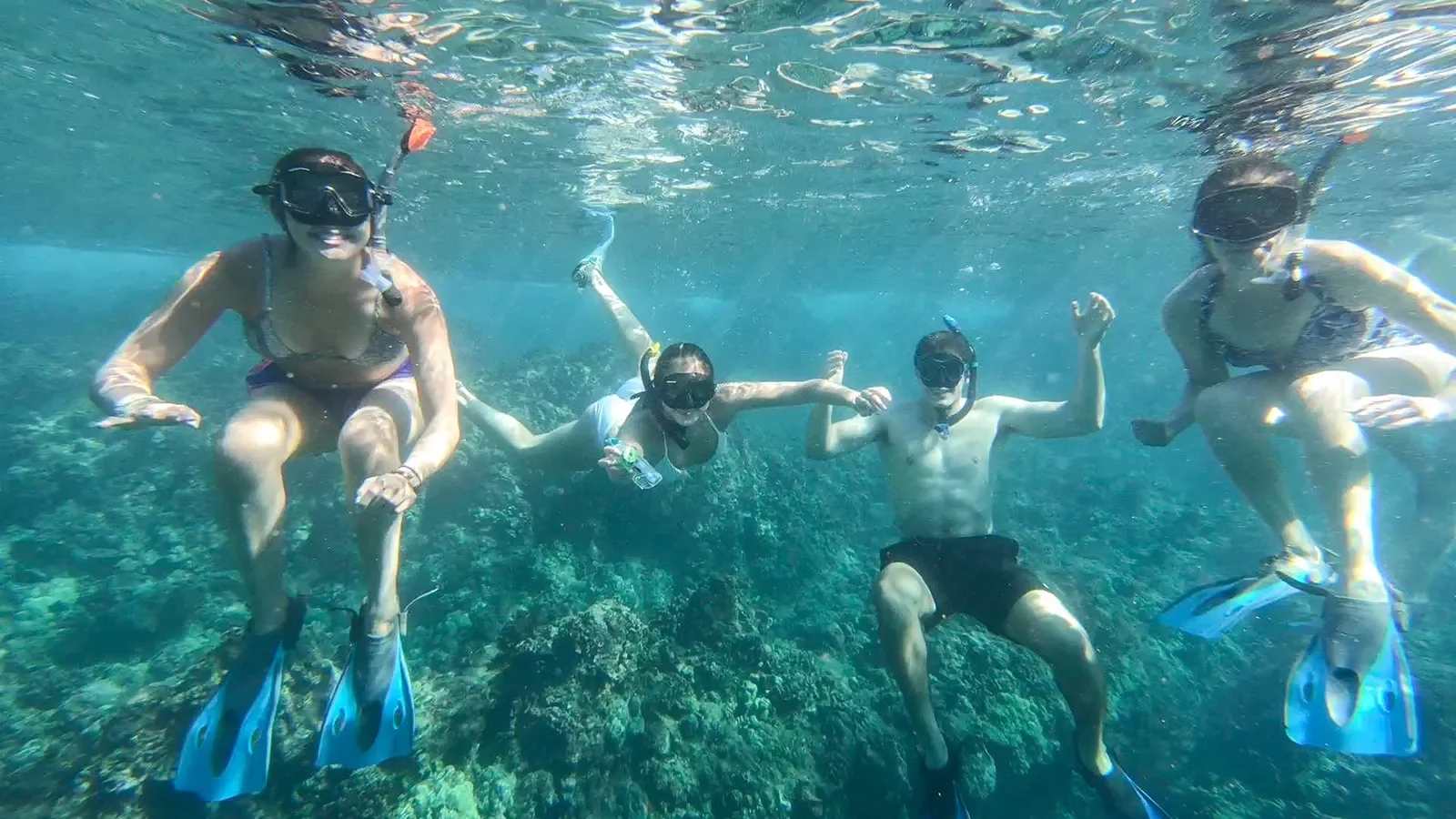 Teenagers snorkeling in Hawaii
