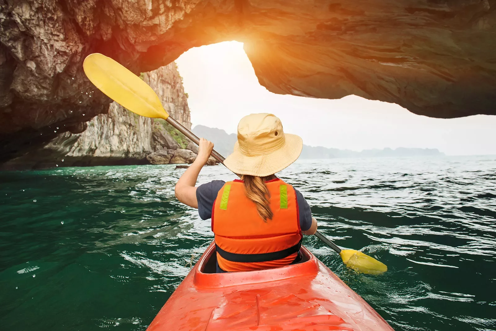 Kayaking among stone arches and cliffs in Vietnam
