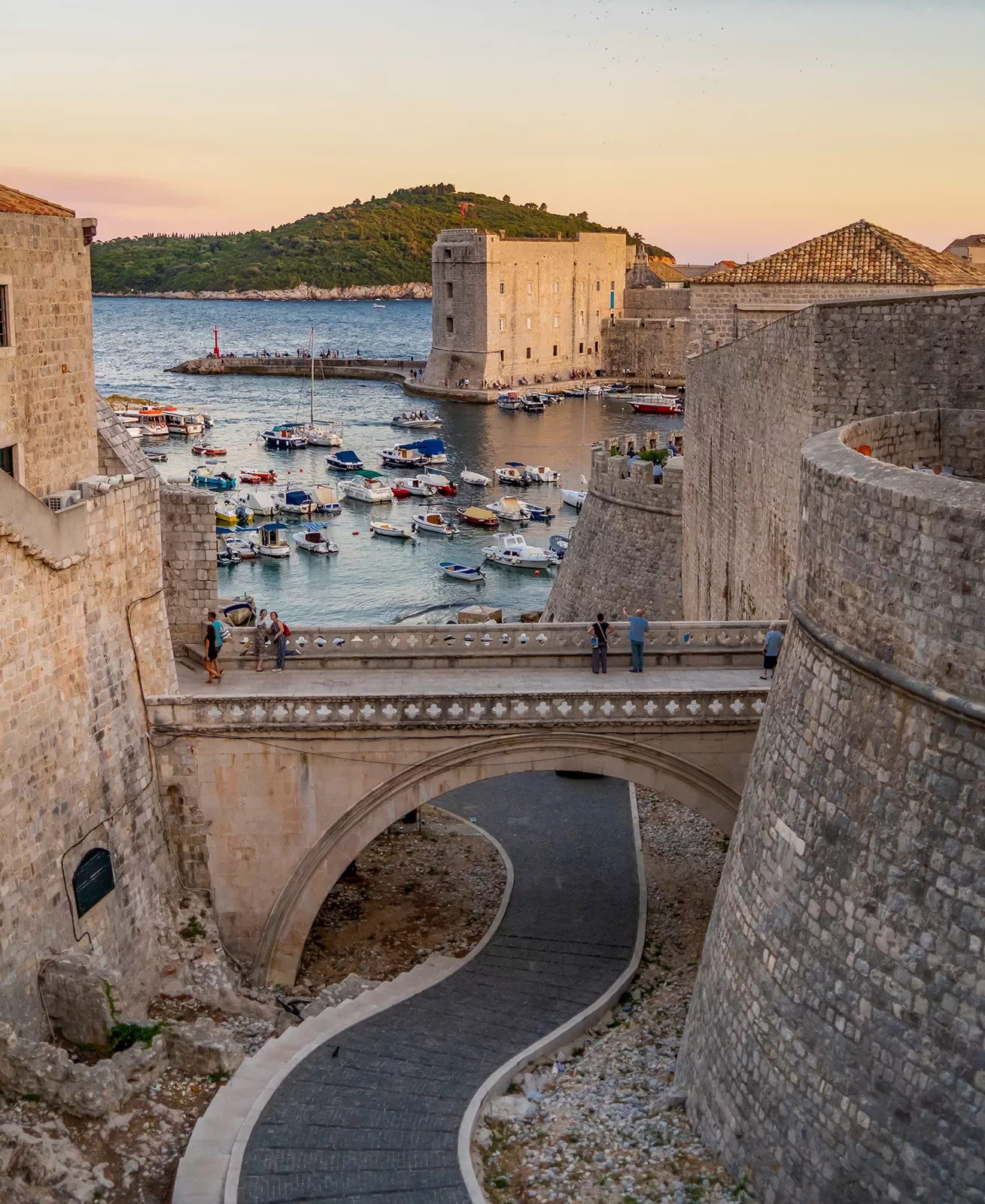 Walled outskirts of Dubrovnik during sunset.