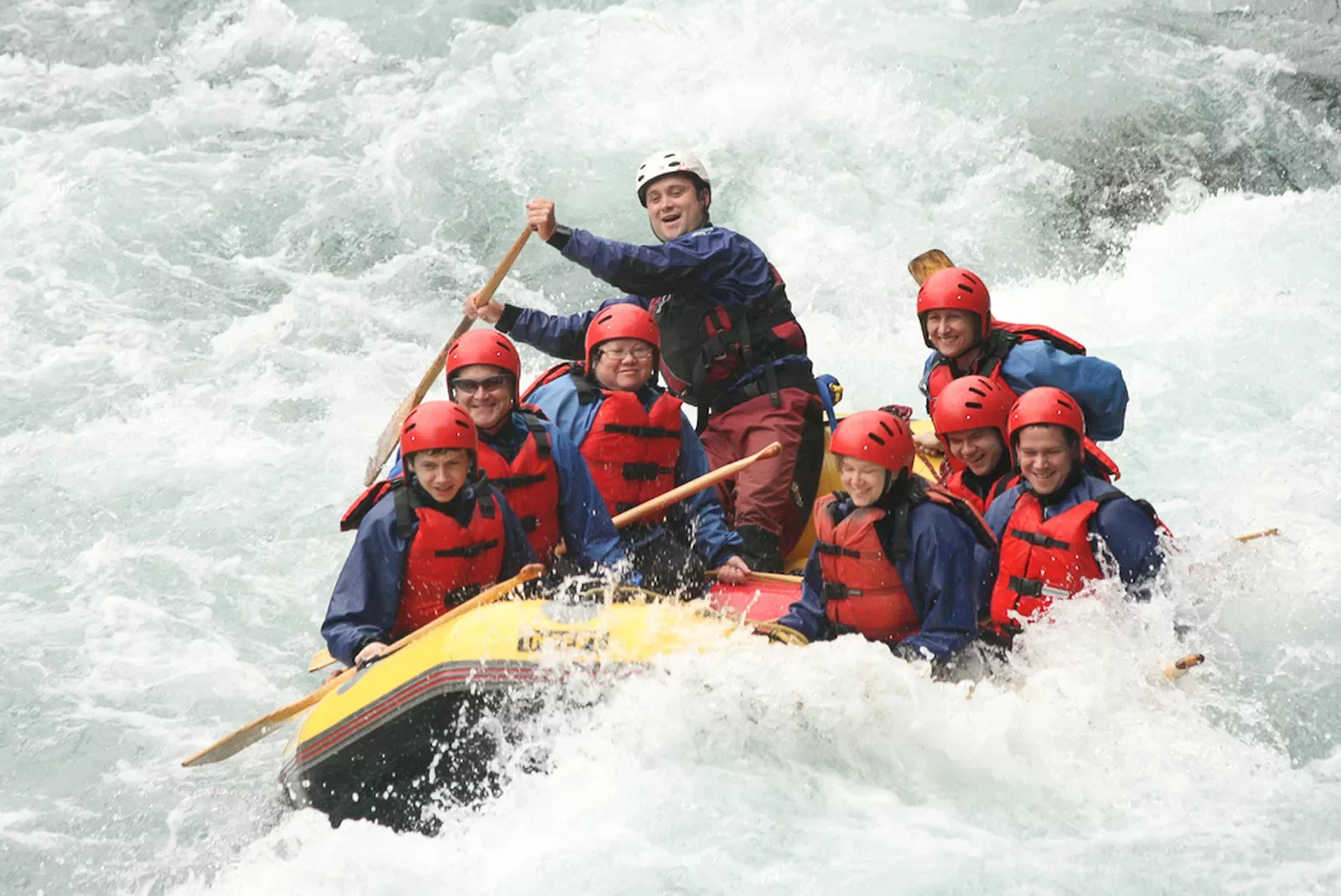 Rafting through white water rapids in New Zealand