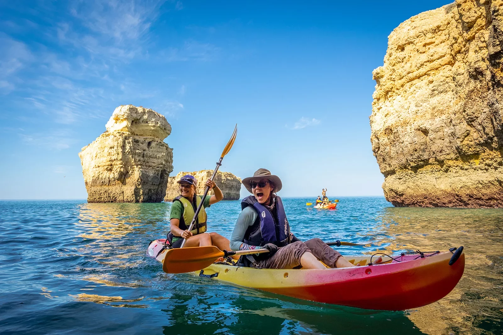 Kayaking among towering rocks in Portugal