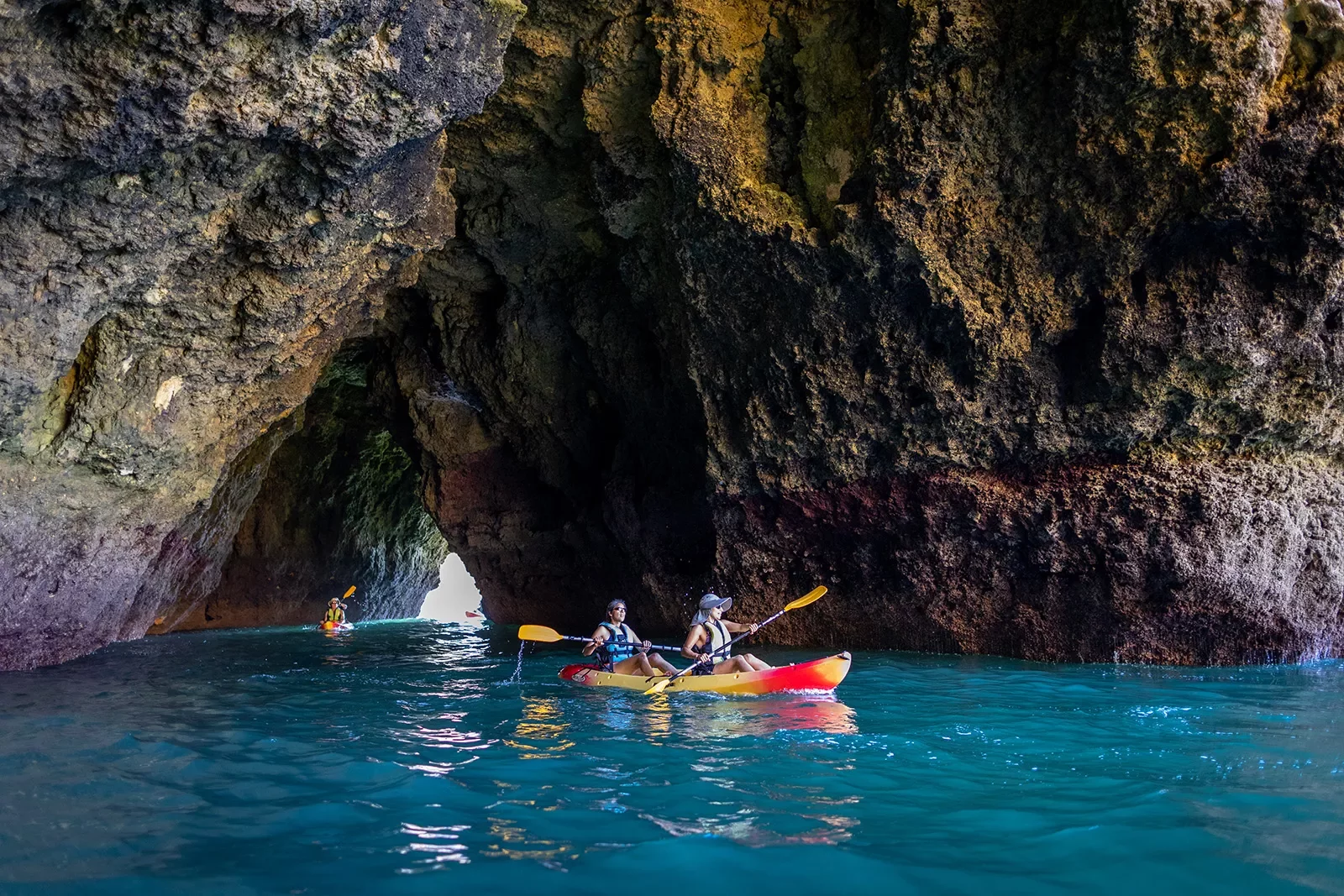 Kayaking through a cave in Portugal