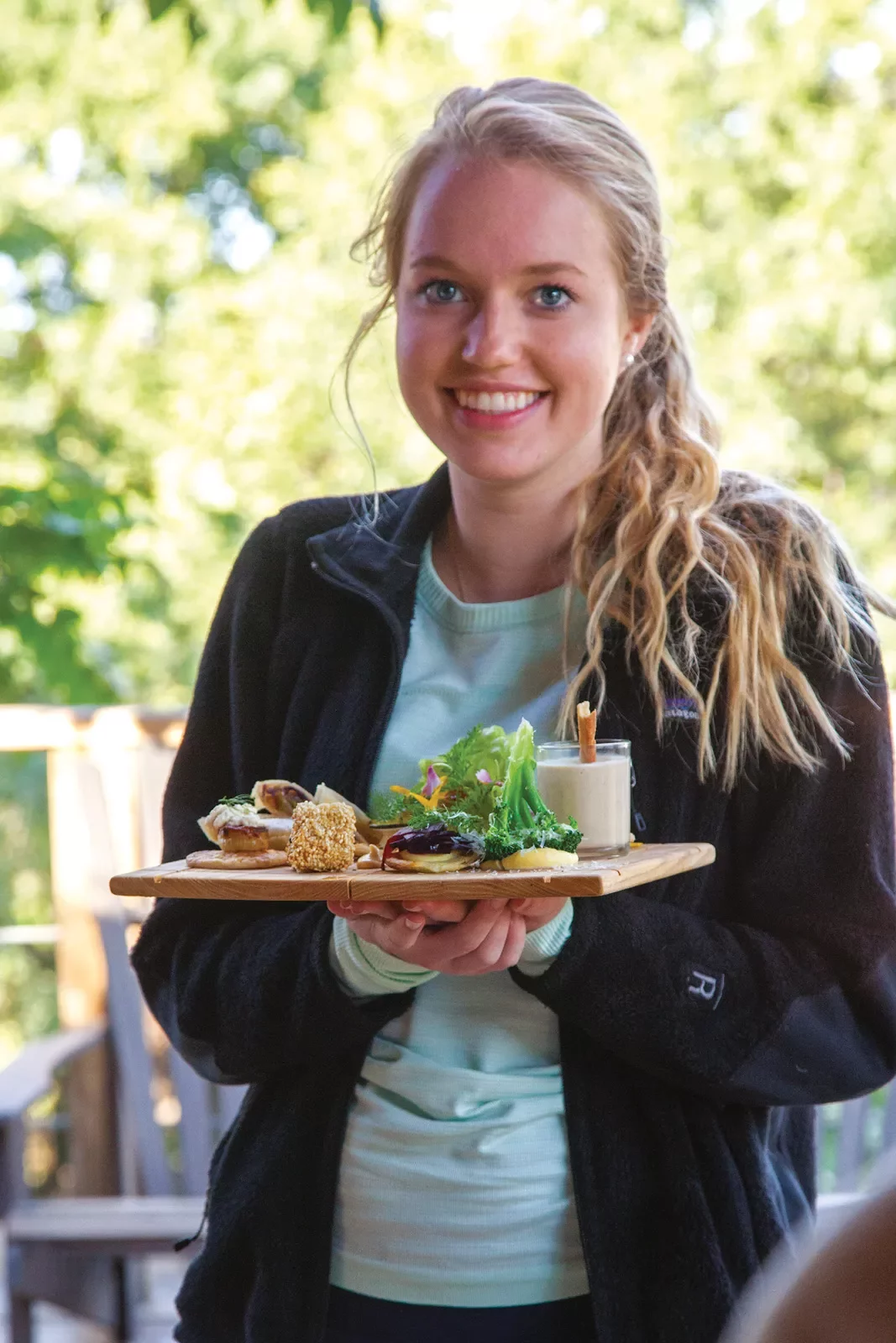 Woman holding plate of food