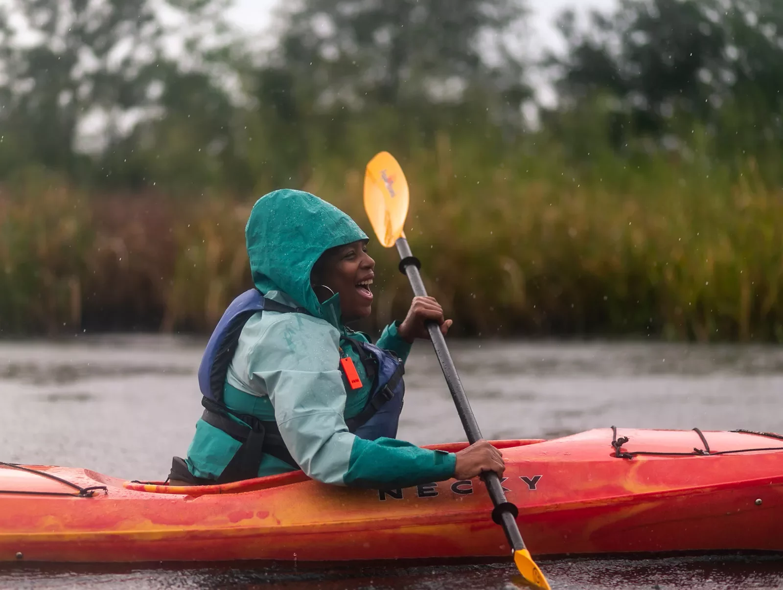 Guest kayaking in rain.