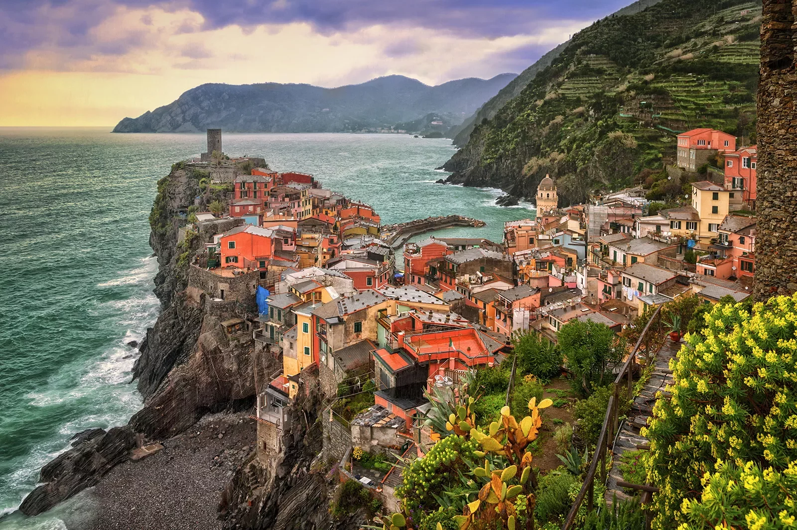 Wide shot of Cinque Terre coastal village.