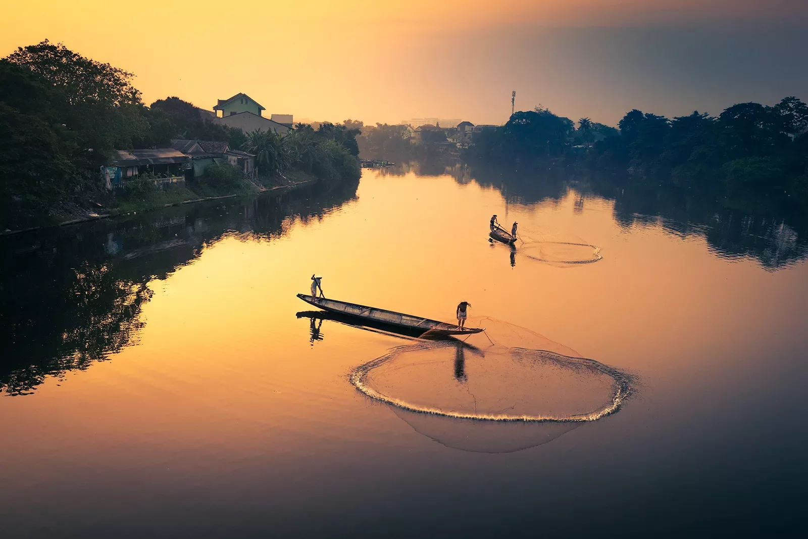 Fishermen in Vietnam at sunet