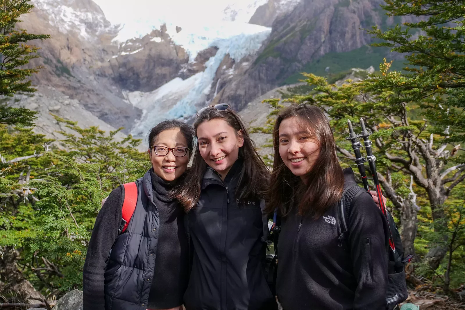 Three hikers posing while in Patagonia.