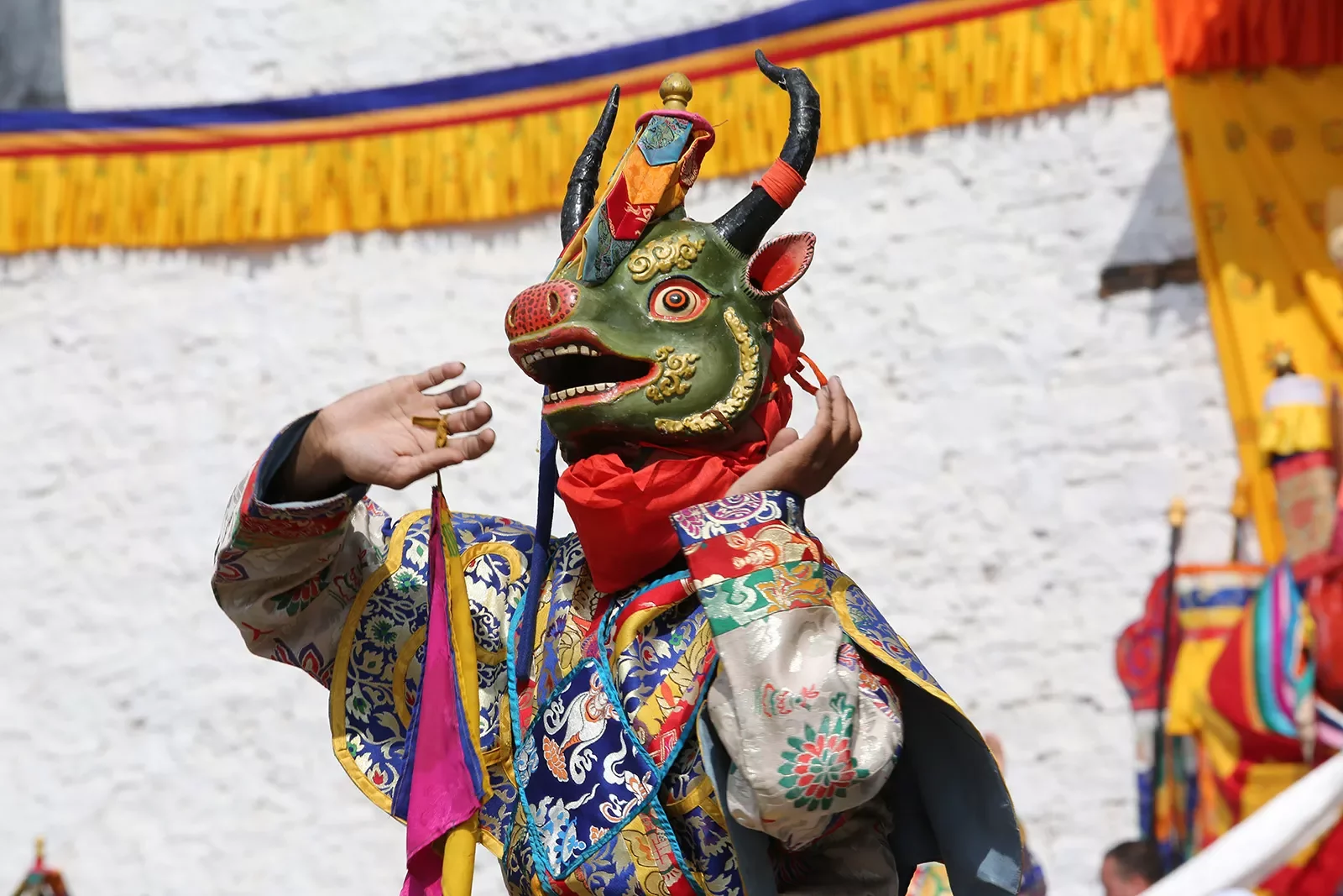 Performer wearing a mask during a performance in Bhutan