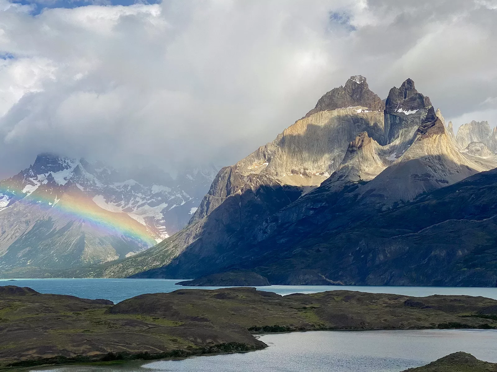 Shot of river, lake, mountains, clouds, ranbow.