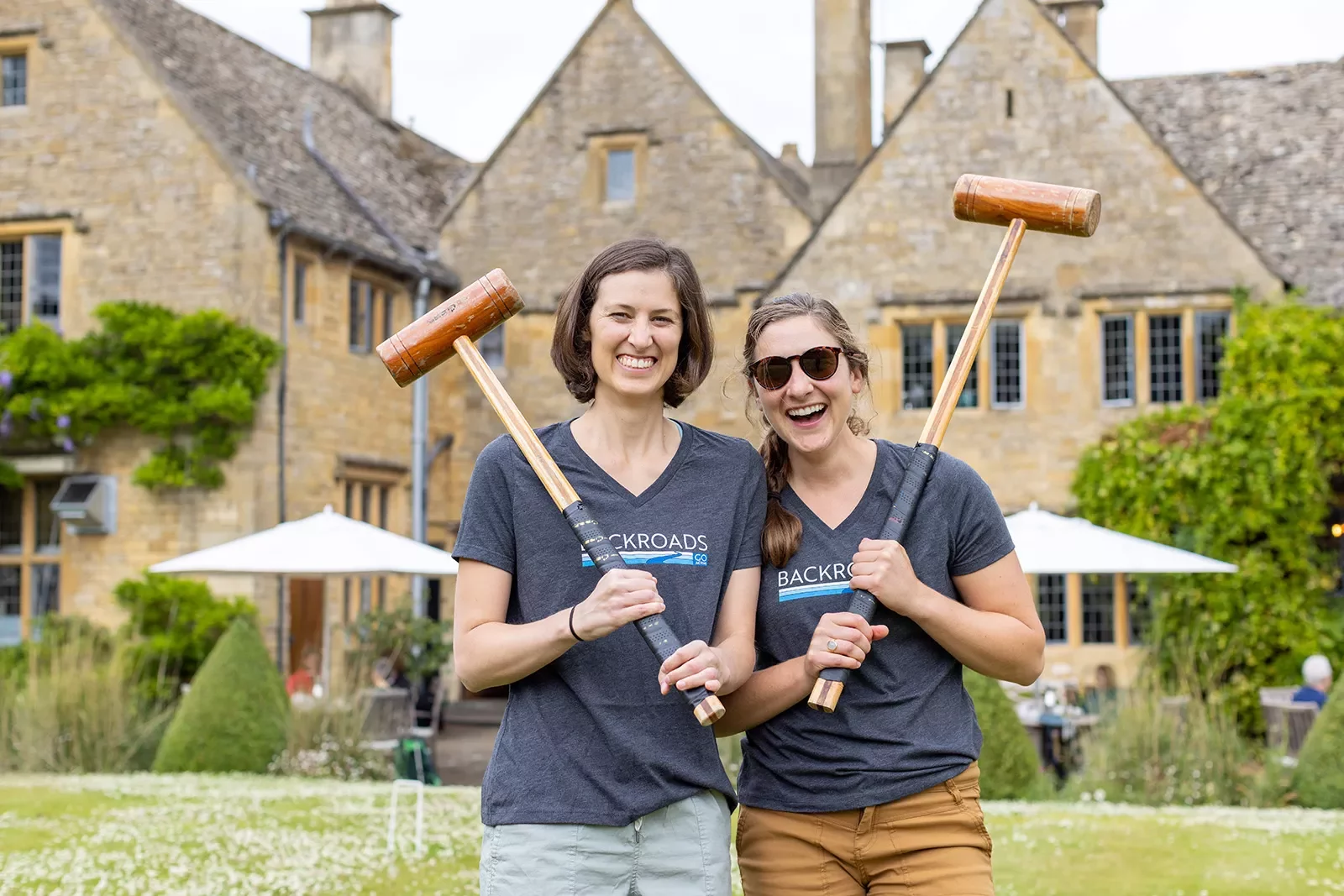 Two Backroads guests playing croquet in England.