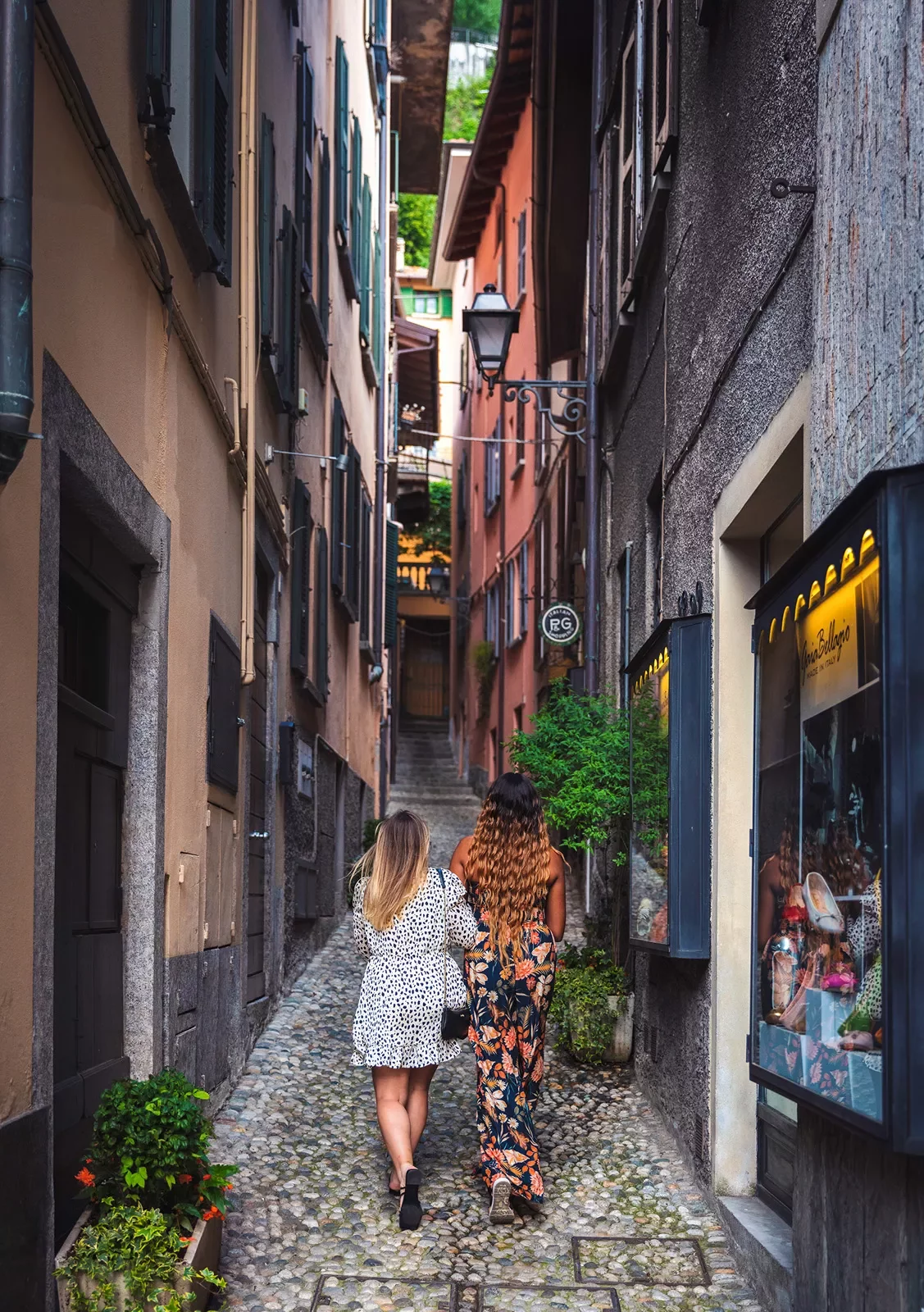 Two guests walking down narrow alleyway.
