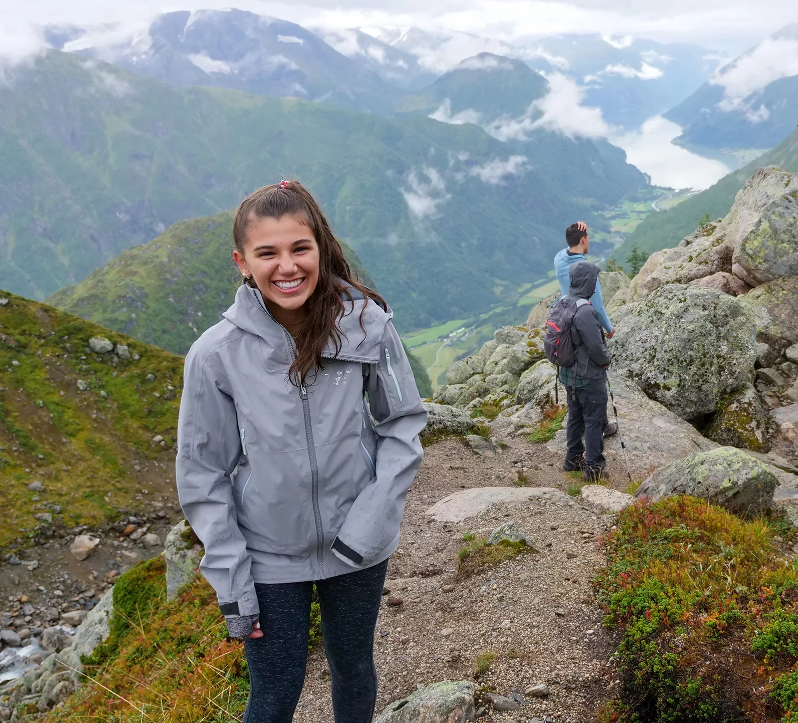 Teenage girl laughing and smiling while hiking in Norway