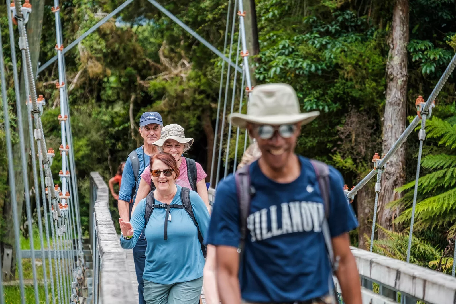 Hiking across a bridge in New Zealand