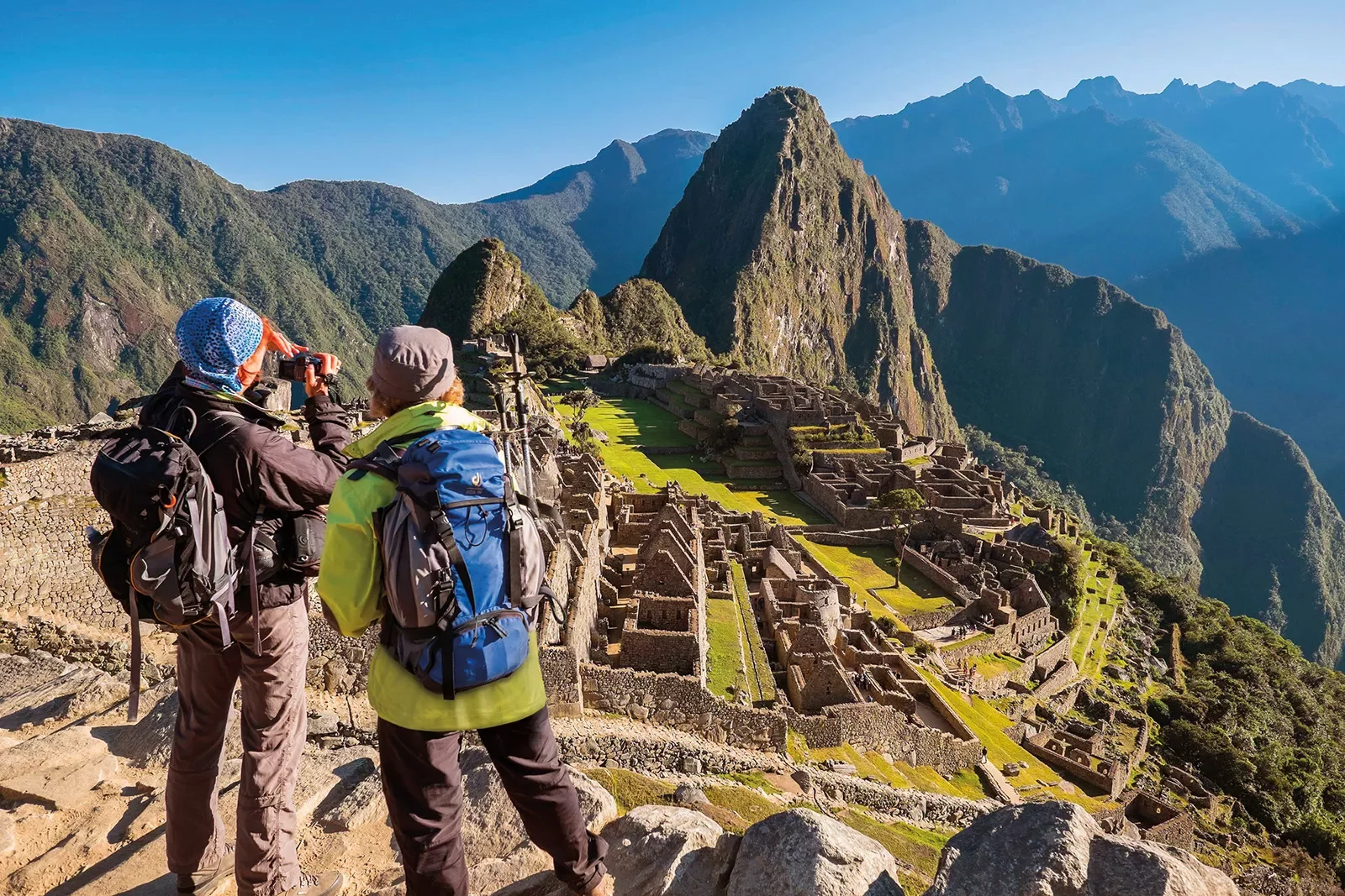 Two guests overlooking Machu Picchu vista.