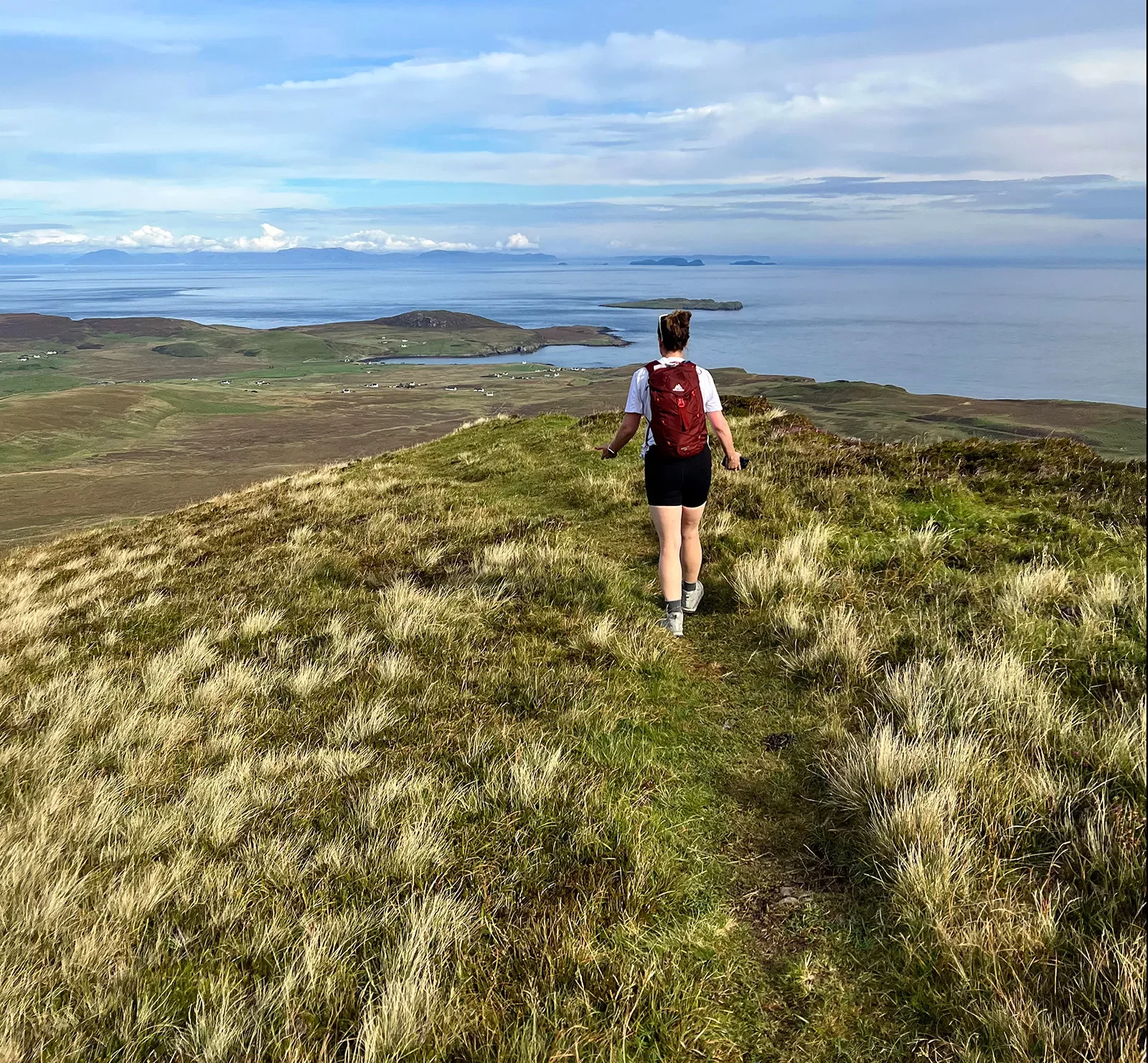 Hiker in Scotland with coastal views