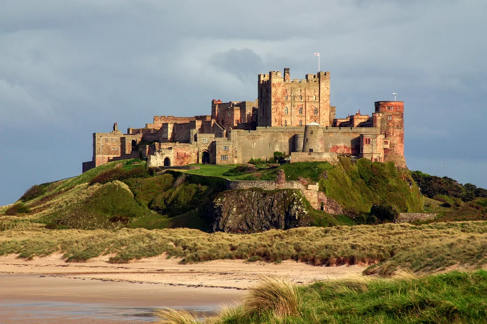 castle on a hill by a beach