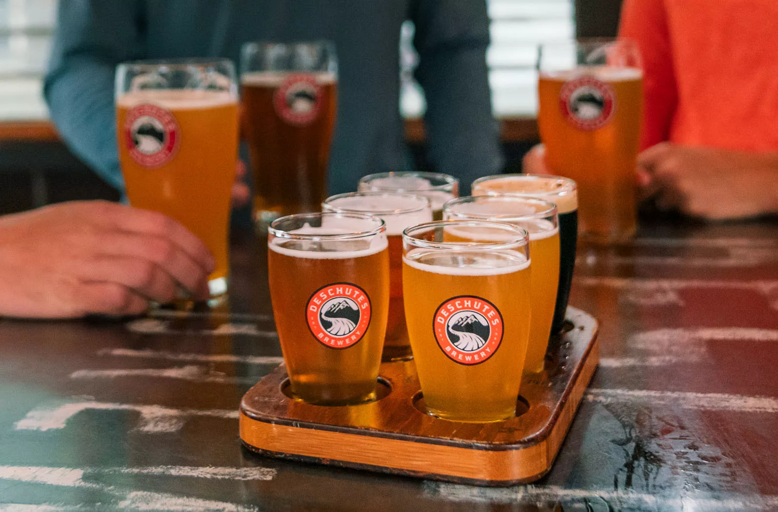 Beer flight on top of a wooden plank