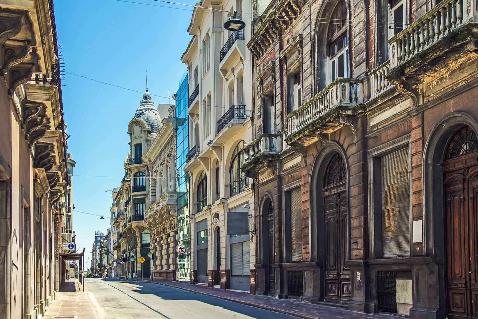 Road with large, European-style apartment buildings on either side